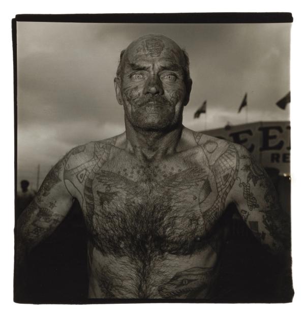 Diane Arbus — Tattooed man at a carnival, Md. 1970