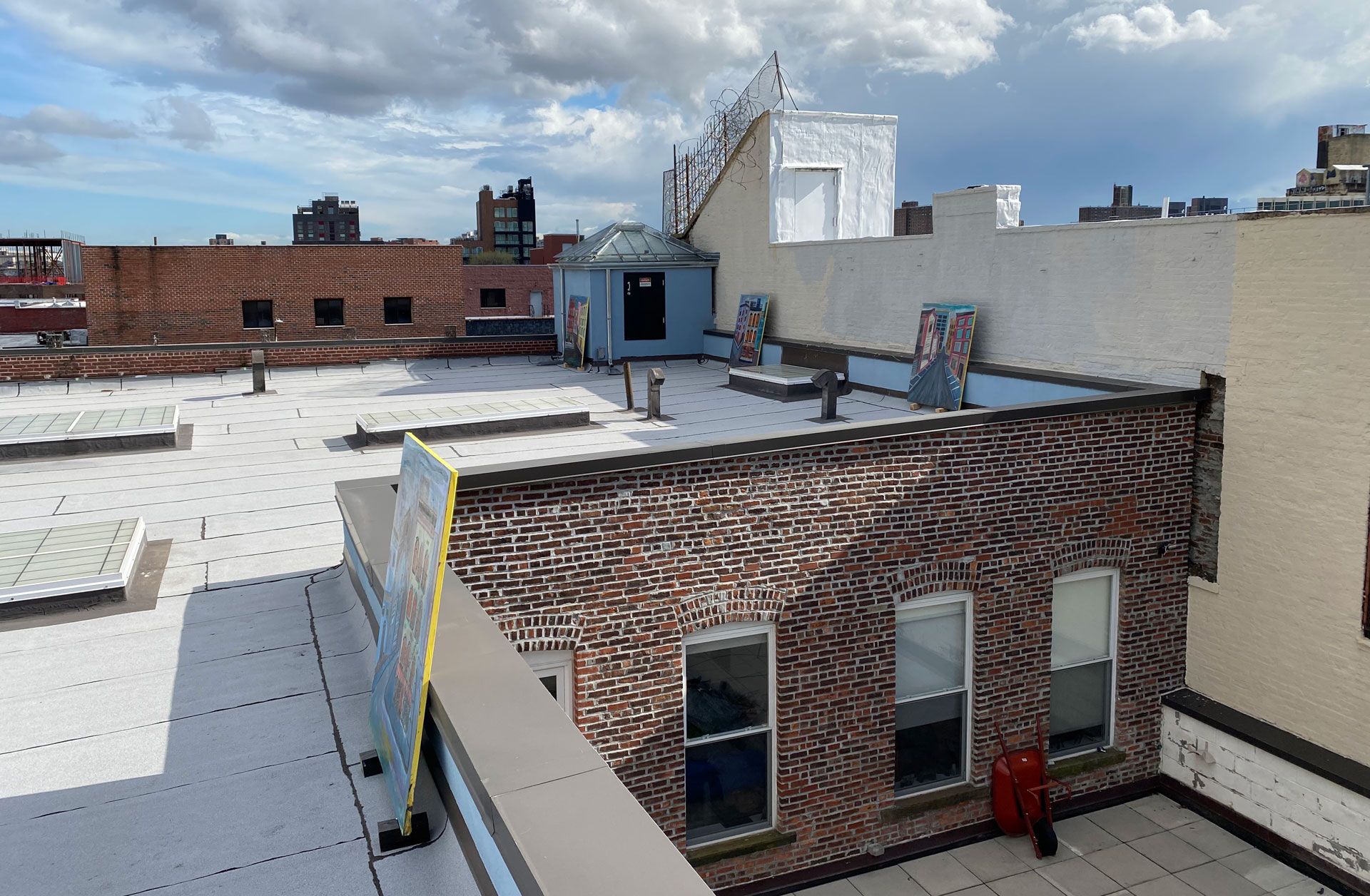 An installation view of the exhibition titled Josh Smith: High As Fuck on the artist's studio roof in Brooklyn, New York, dated 2020.