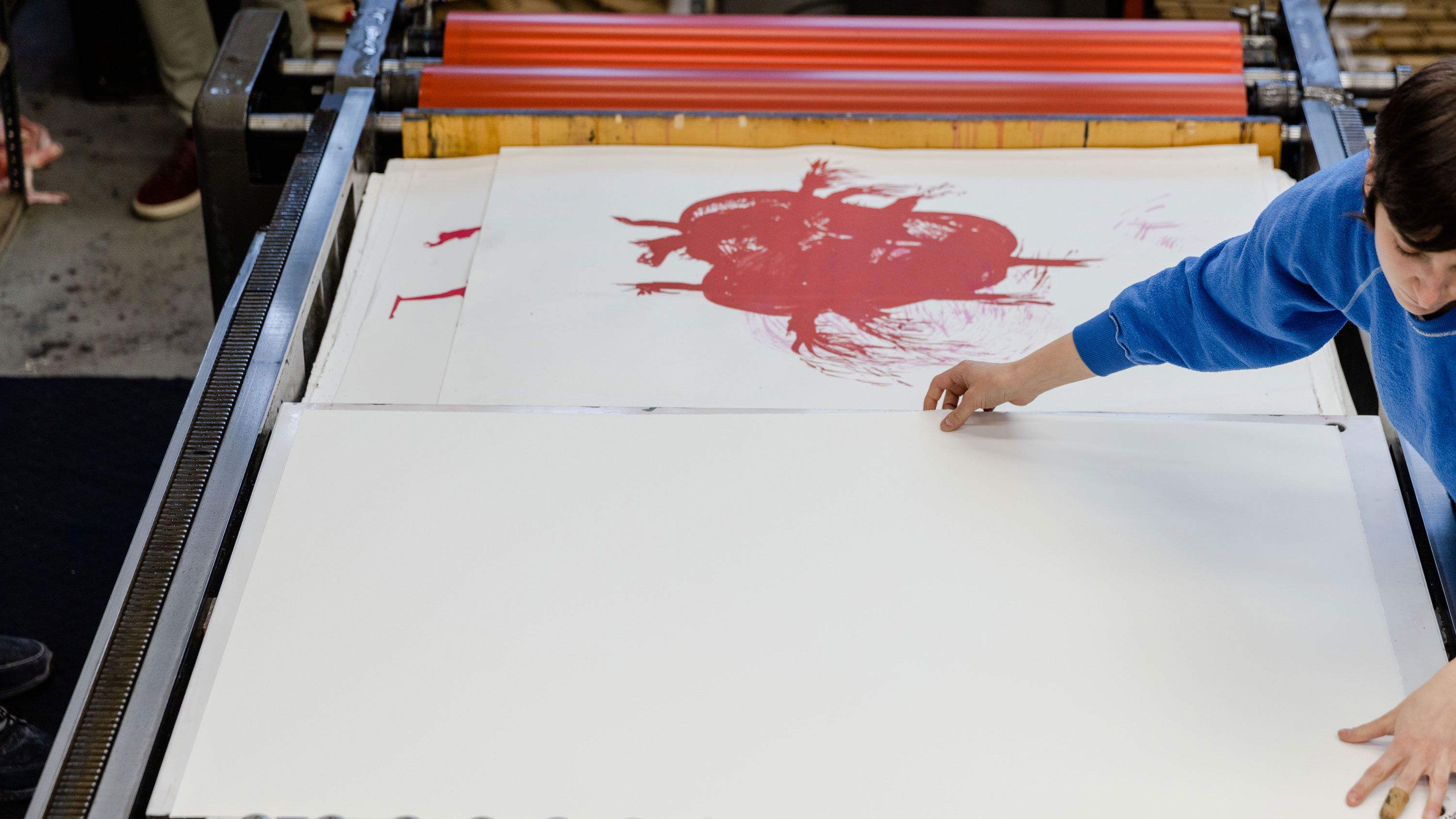 A photograph of Raymond Pettibon's print "No Title (He doesn't really...)" being printed at Derriere L’Etoile Studios in New York, 2022.
