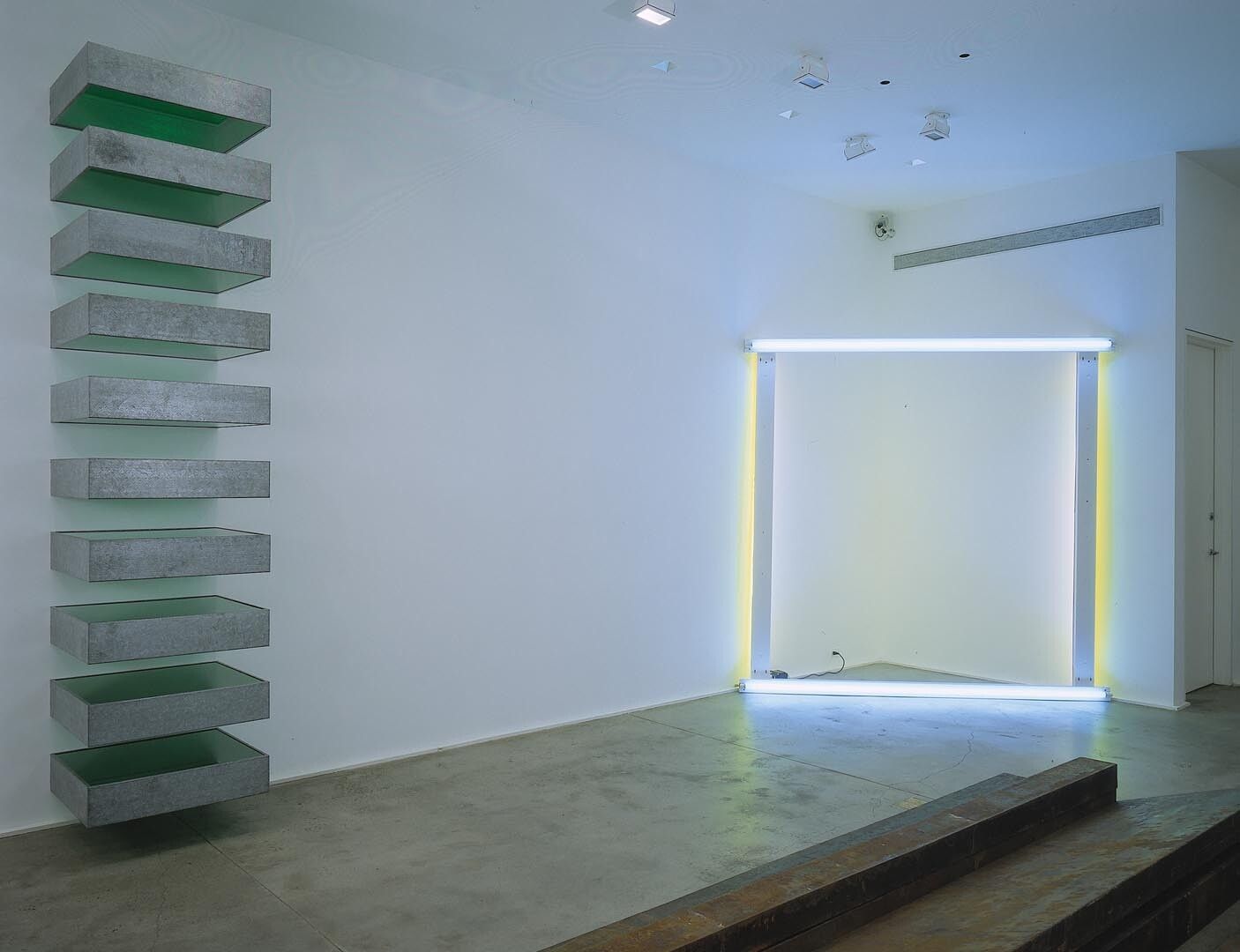 An installation view of the exhibition Early Works: Flavin, Judd, LeWitt, Serra, at David Zwirner New York, dated 2003.