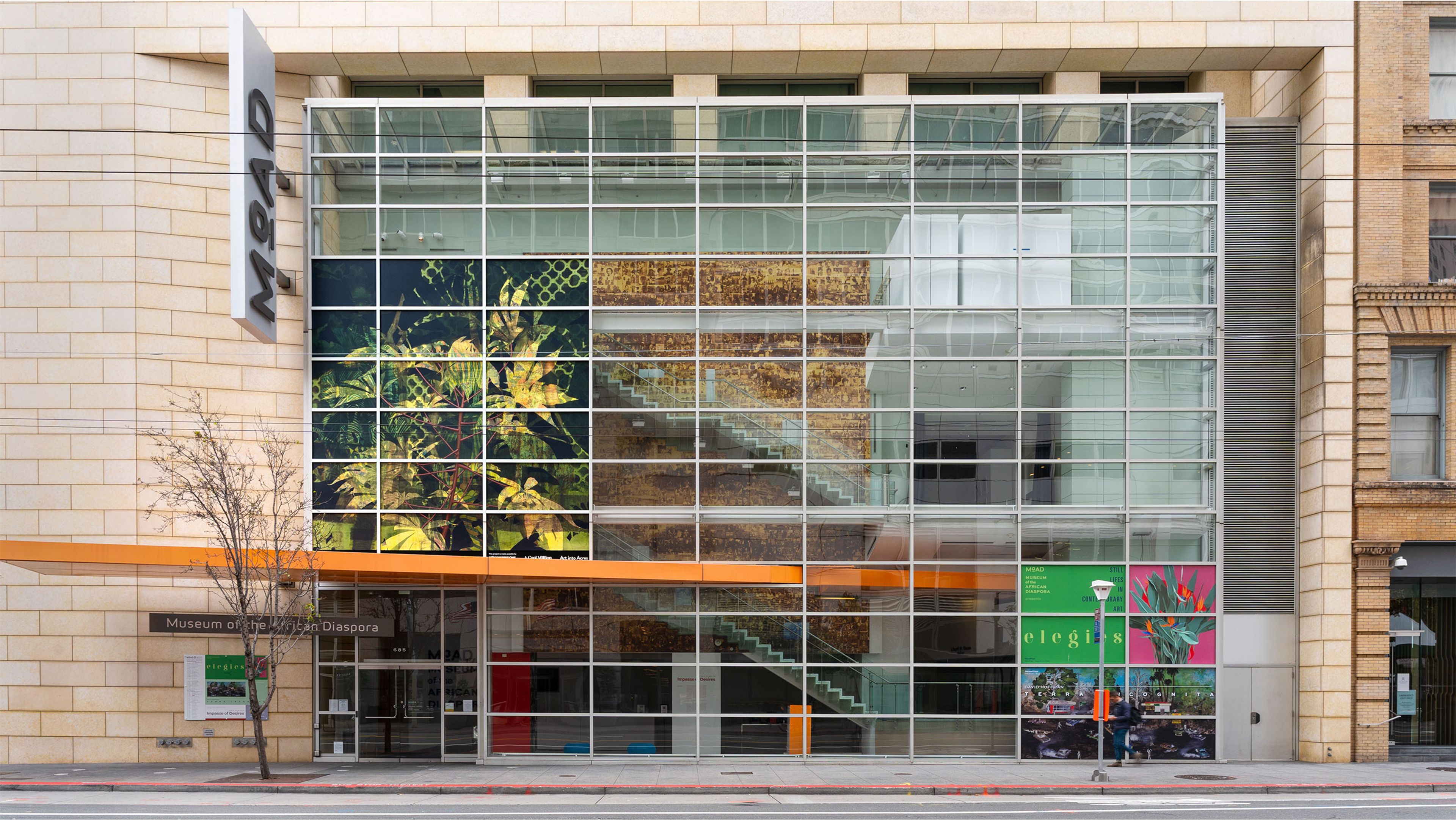 Installation view of a mural by Njideka Akunyili Crosby, titled Dwellers: Native One, at the Museum of the African Diaspora in San Francisco, California, dated 2022.