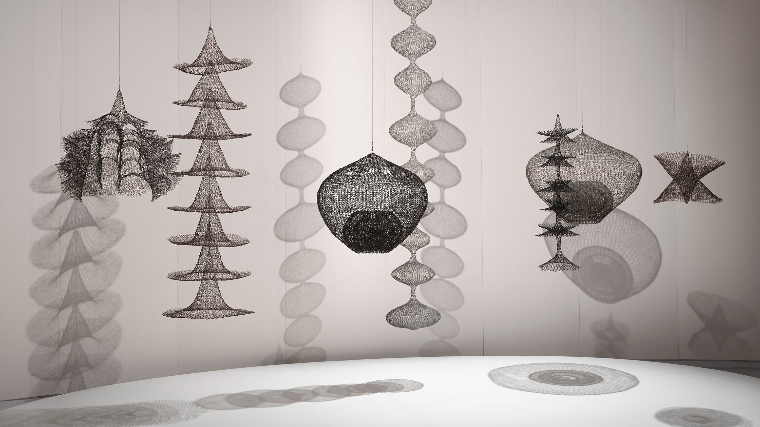 A horizontal installation view of Ruth Asawa's sculpture works at the 59th International Art Exhibition of La Biennale di Venezia titled The Milk of Dreams, curated by Cecilia Alemani in 2022