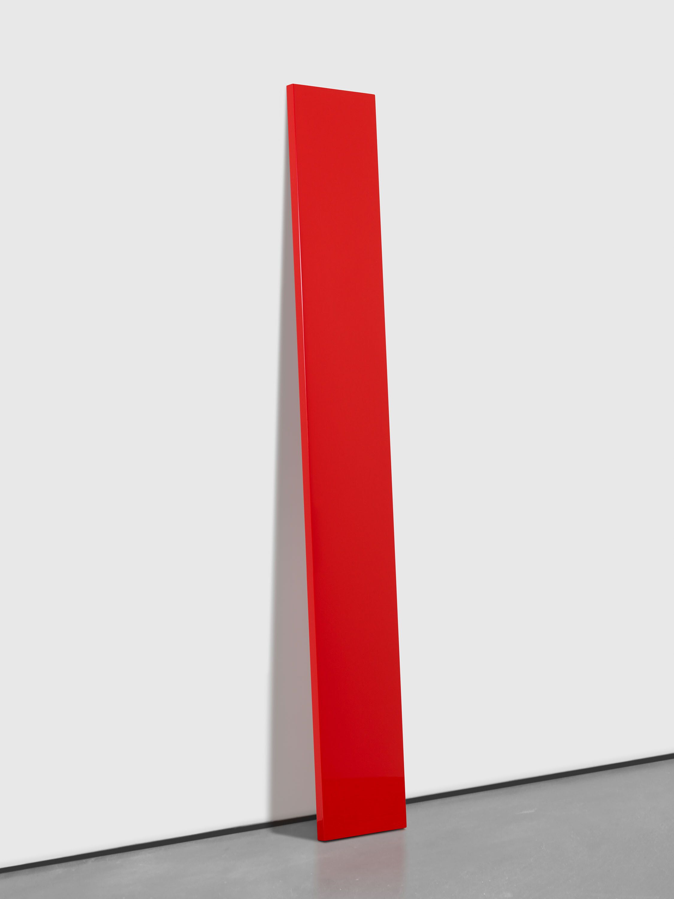 An untitled polyester resin, fiberglass, and plywood sculpture, titled Untitled (Red Plank), by John McCracken, dated 1976.