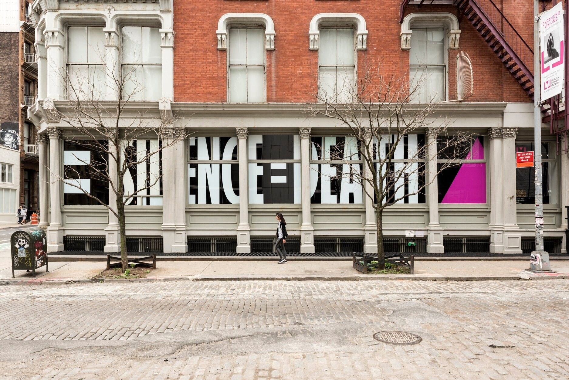 A photo of the Silence=Death slogan in the window of the Leslie-Lohman Museum in 2017.