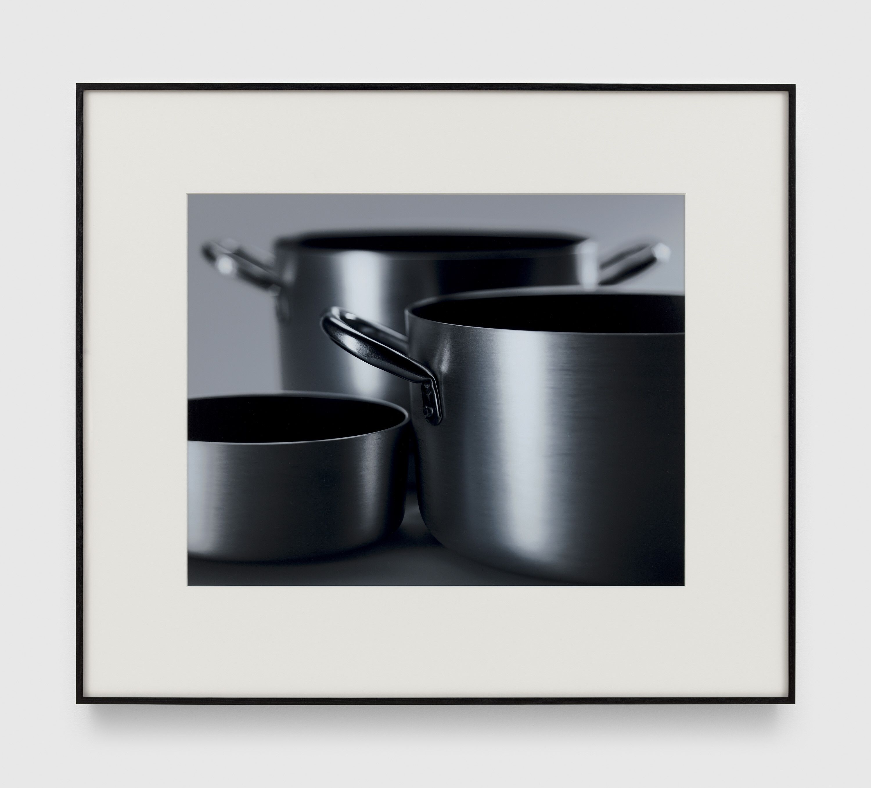 A photograph by Christopher Williams, titled Best.Nr.: 68011, Best.Nr.: 28856, Best.Nr.: 28856 Devoid of any creative airs and graces, well-proportioned and of recogni- sable quality. The basic material – cold forged aluminum with high material thickness – is not only one of the best heat conductors, but also extremely light and therefore easy to handle. With a constant thickness, the pots’ bases ensure even heat distribution and perfect thermal absorption. Rea- ching cooking temperature the pan fully stabilizes and adjusts itself perfect- ly to the stove. The resilient stainless-steel tube-shaped handles reduce heat transmission. Low maintenance and ruggedness are increased by the ceramic-enhanced non-stick coating of the internal surfaces. Still, we re- commend considerate handling by using proper tools. Not suitable for in- duction hobs. All lids are interchangeable in equivalent sizes. Material: brushed aluminum – dishwasher safe Sauce Pan, with handle: Dimensions: Ø 20 x 8 cm / Capacity: 2.3 L / Weight: 710g Stew Pot: Dimensions: Ø 28 × 16.5 cm / Capacity: 9.2 L / Weight: 1.6kg Studio Rhein Verlag, Düsseldorf January 26, 2017, dated 2017.