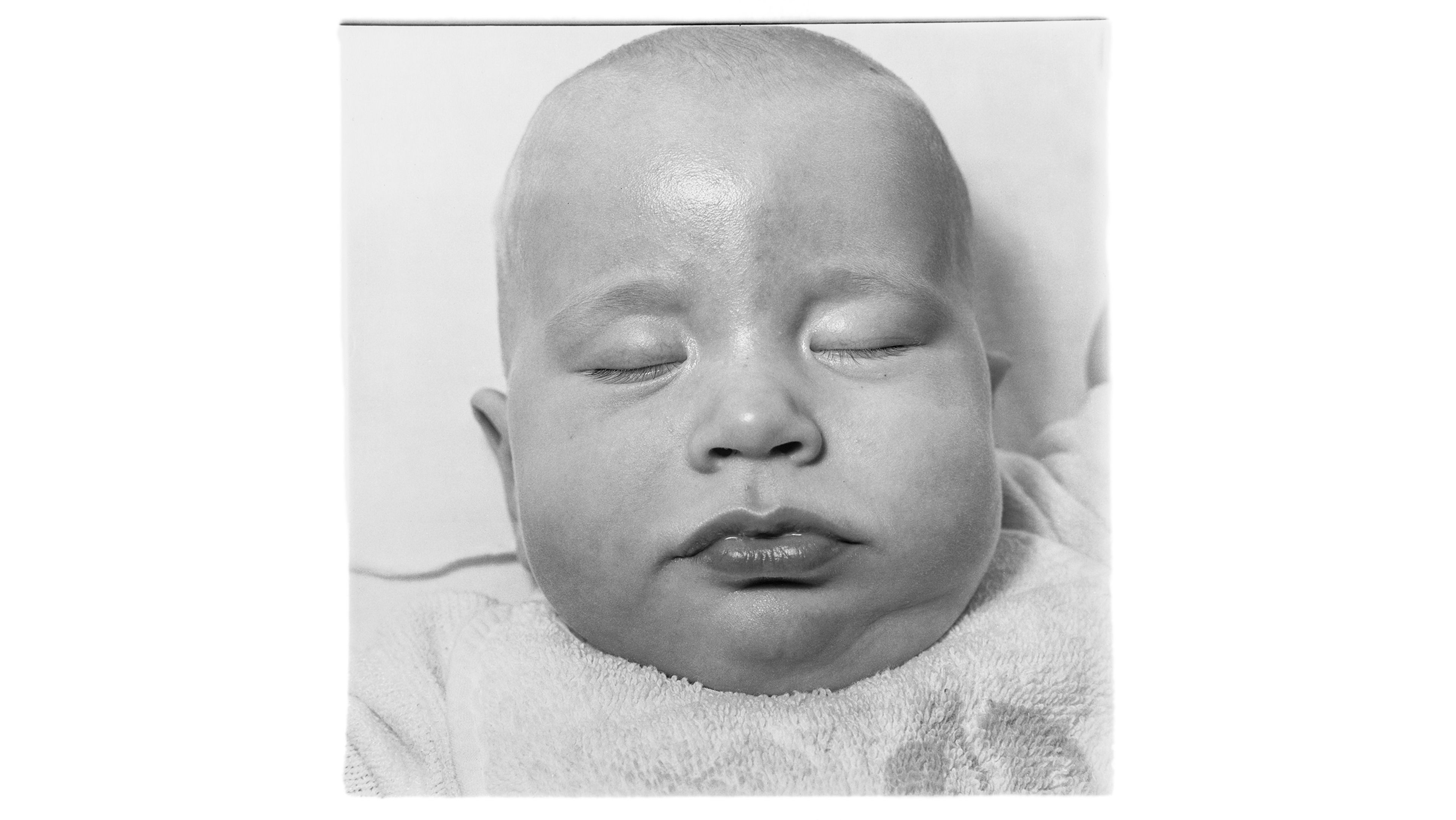 A photograph by Diane Arbus, titled A very young baby, N.Y.C. [Anderson Hays Cooper], dated 1968