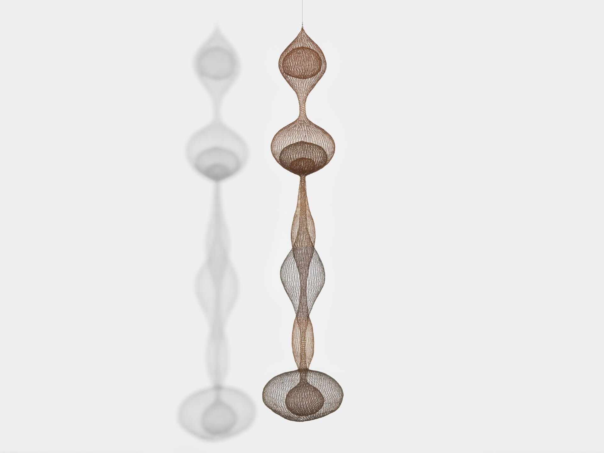 A sculpture by Ruth Asawa, titled Untitled (S.563, Hanging Six Lobed Form with Two Interior Spheres), dated 1956.
