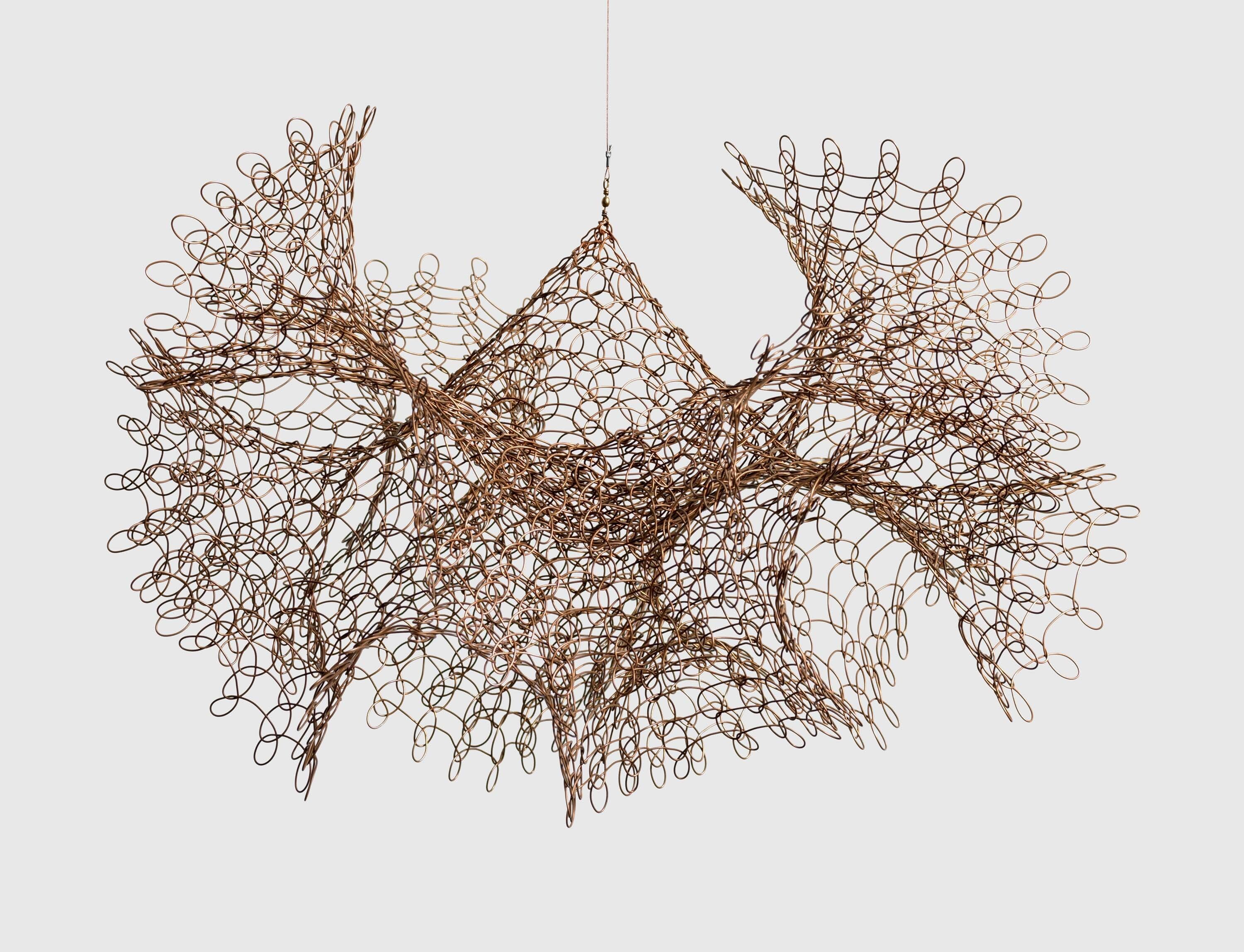 A copper wire sculpture by Ruth Asawa, called Untitled (S.350, Hanging Two Interlocking Forms with Fluted Edges), circa 1960s.