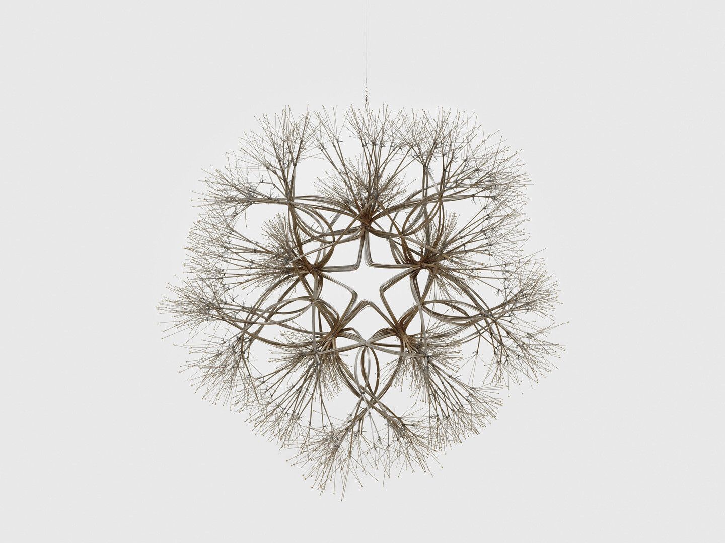 A hanging stainless steel wire sculpture by Ruth Asawa, titled Wintermass (S.187, Hanging Tied-Wire, Double-Sided, Open-Center, Five-Branched Form Based on Nature). circa 1974.