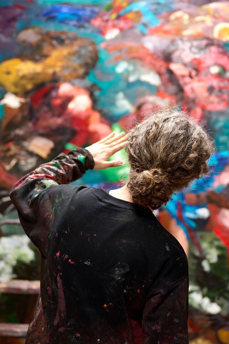 A photo of Dana Schutz in her studio, 2023. Photo by Jason Schmidt