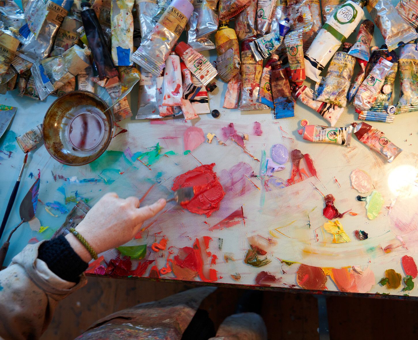 A Photo by Jason Schmidt of Lisa Yuskavage in her studio, dated 2020