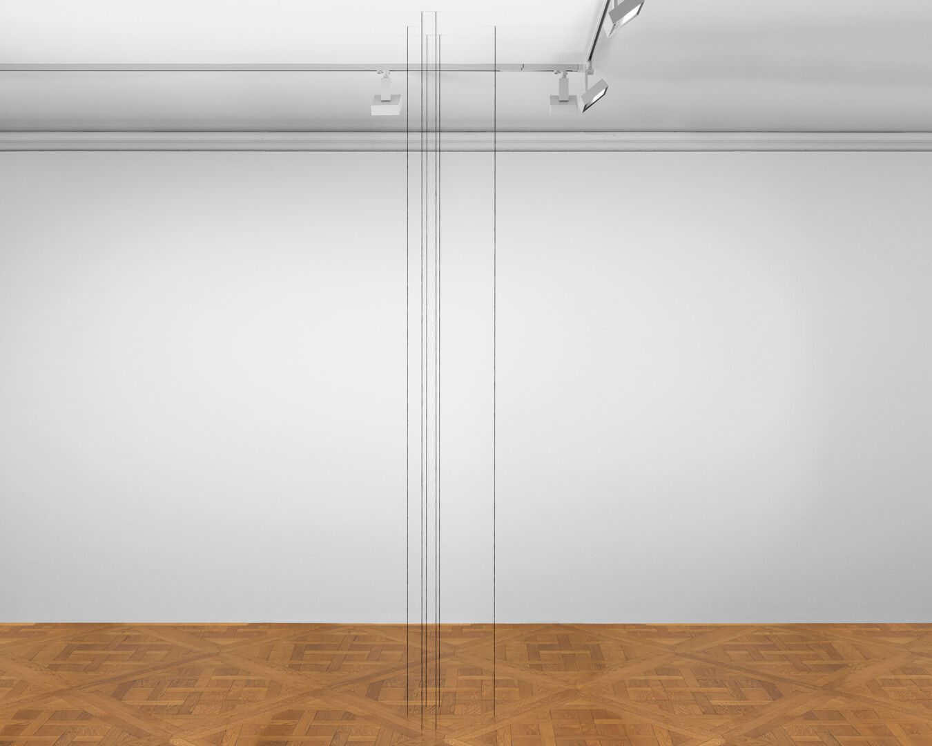 A black acrylic yarn sculpture by Fred Sandback, titled Untitled (Sculptural Study, Six-part Vertical Construction), dated 1993 and 2011.