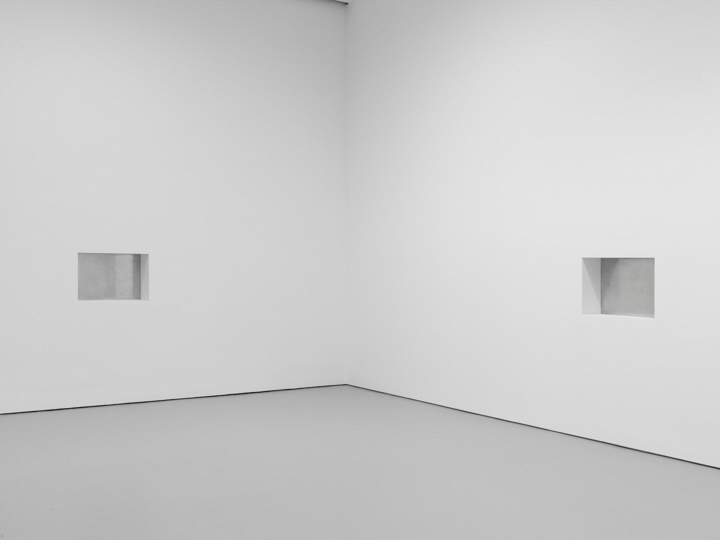 Two untitled recesses in a wall, with galvanized iron in the back of the recesses by Donald Judd, dated 1992.