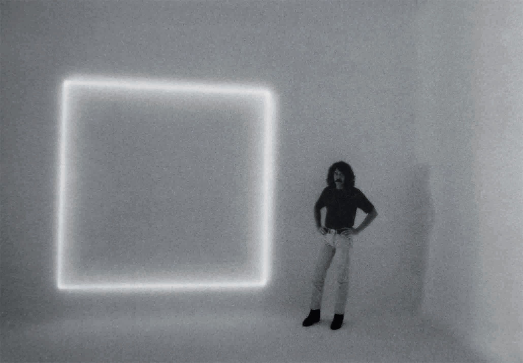 A photograph of Doug Wheeler with his work titled RM 669, at 2623 Main Street studio, Ocean Park, Santa Monica, circa 1972.