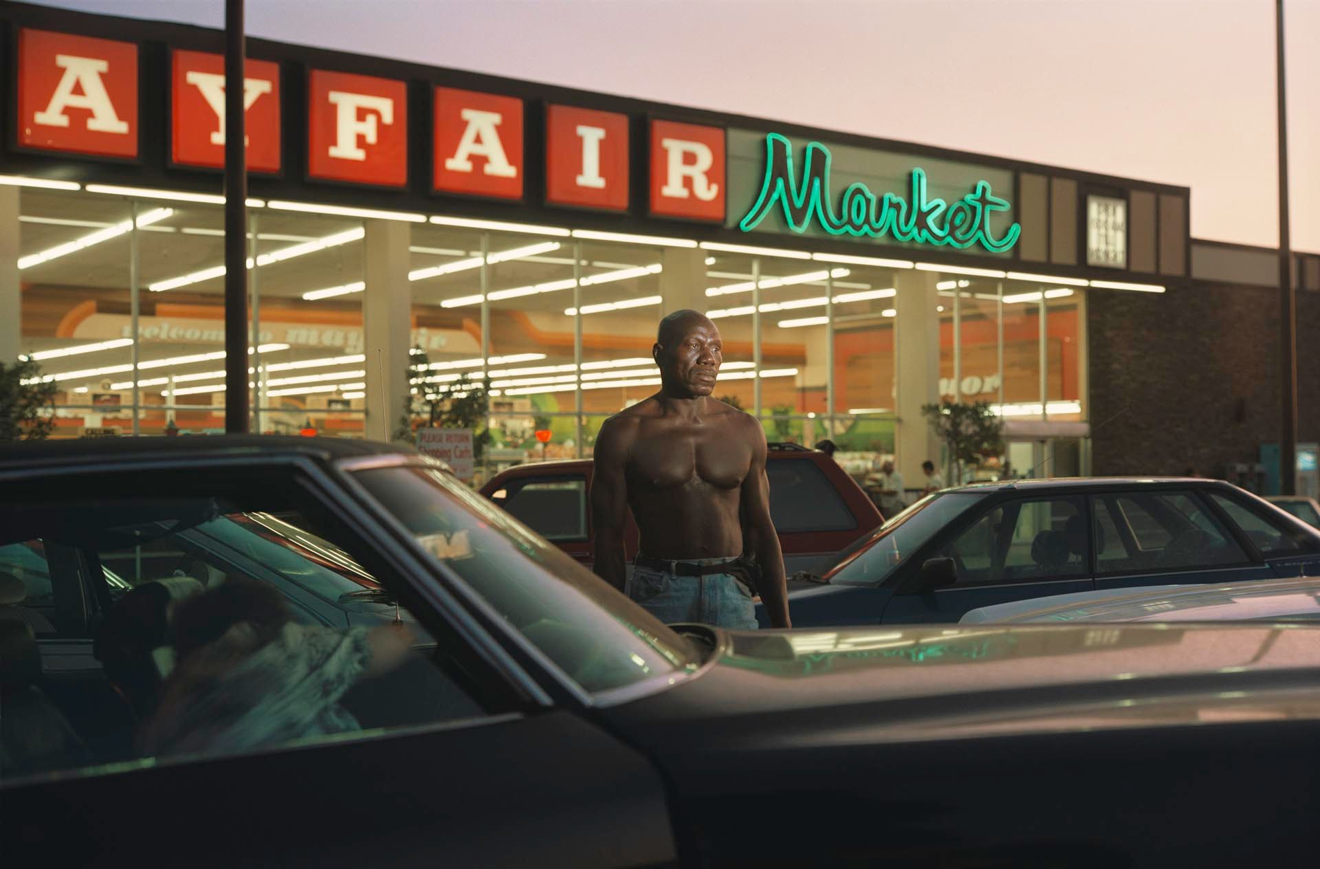 A photograph by Philip-Lorca diCorcia, titled Ike Cole, 38 years old, Los Angeles, California, 25 dollars, dated 1990 to 1992.