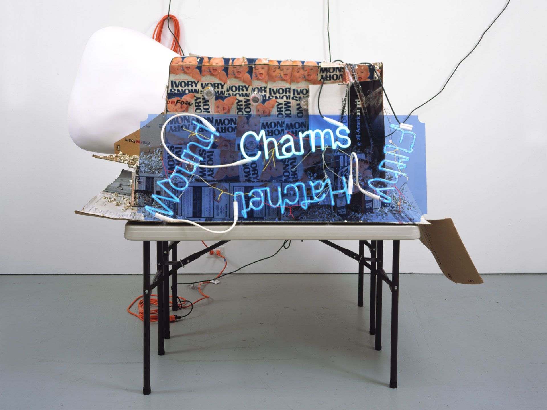 A sculpture by Jason Rhoades, titled Wailing Wall / Los Feliz Costco and Unpainted Camel Toe, dated 2003.
