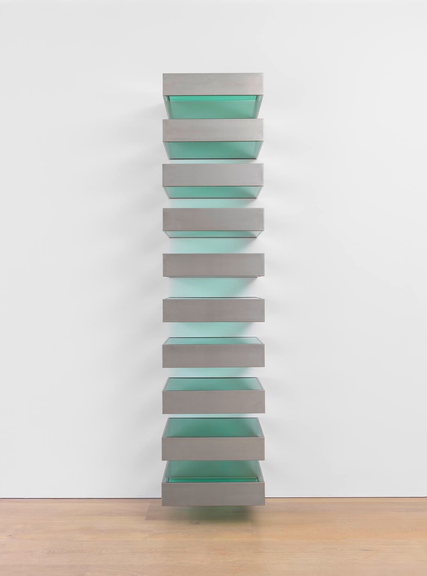 An untitled, ten unit, stainless steel and transparent green acrylic sheet sculpture by Donald Judd, dated 1989.