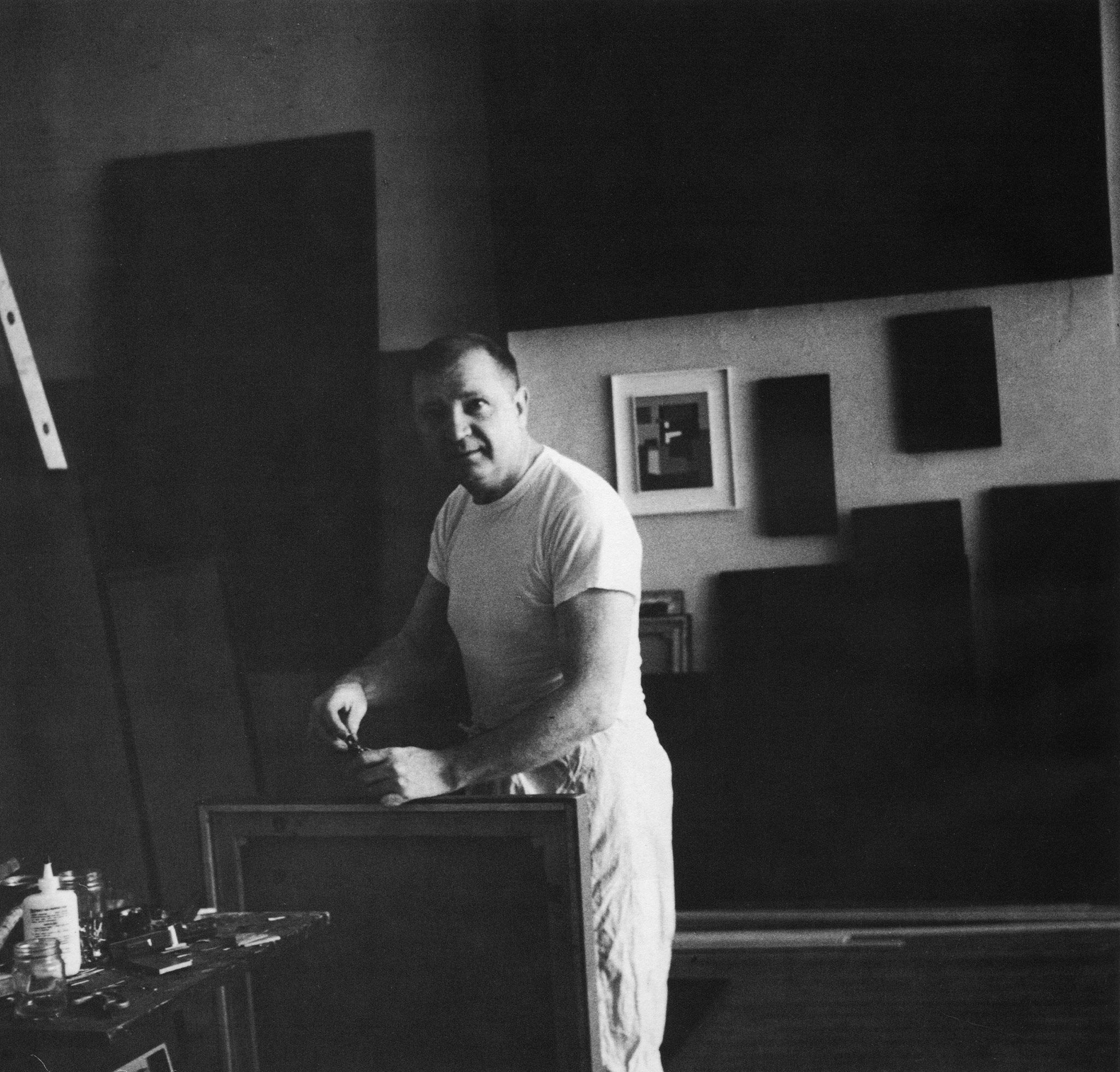 A photo of Ad Reinhardt in his studio.