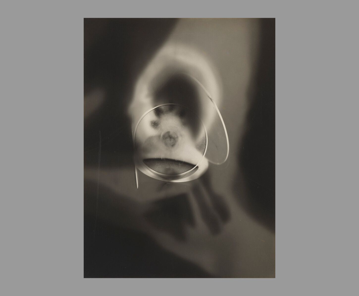 A detail of a work by Man Ray, titled Rayograph, dated 1923.