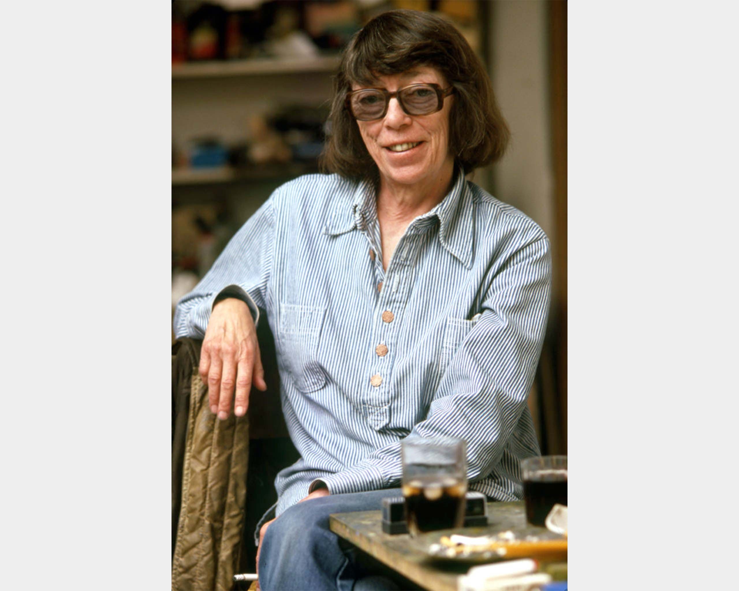 A photo by Robert Freson of Joan Mitchell in her studio in Vétheuil, dated 1983.
