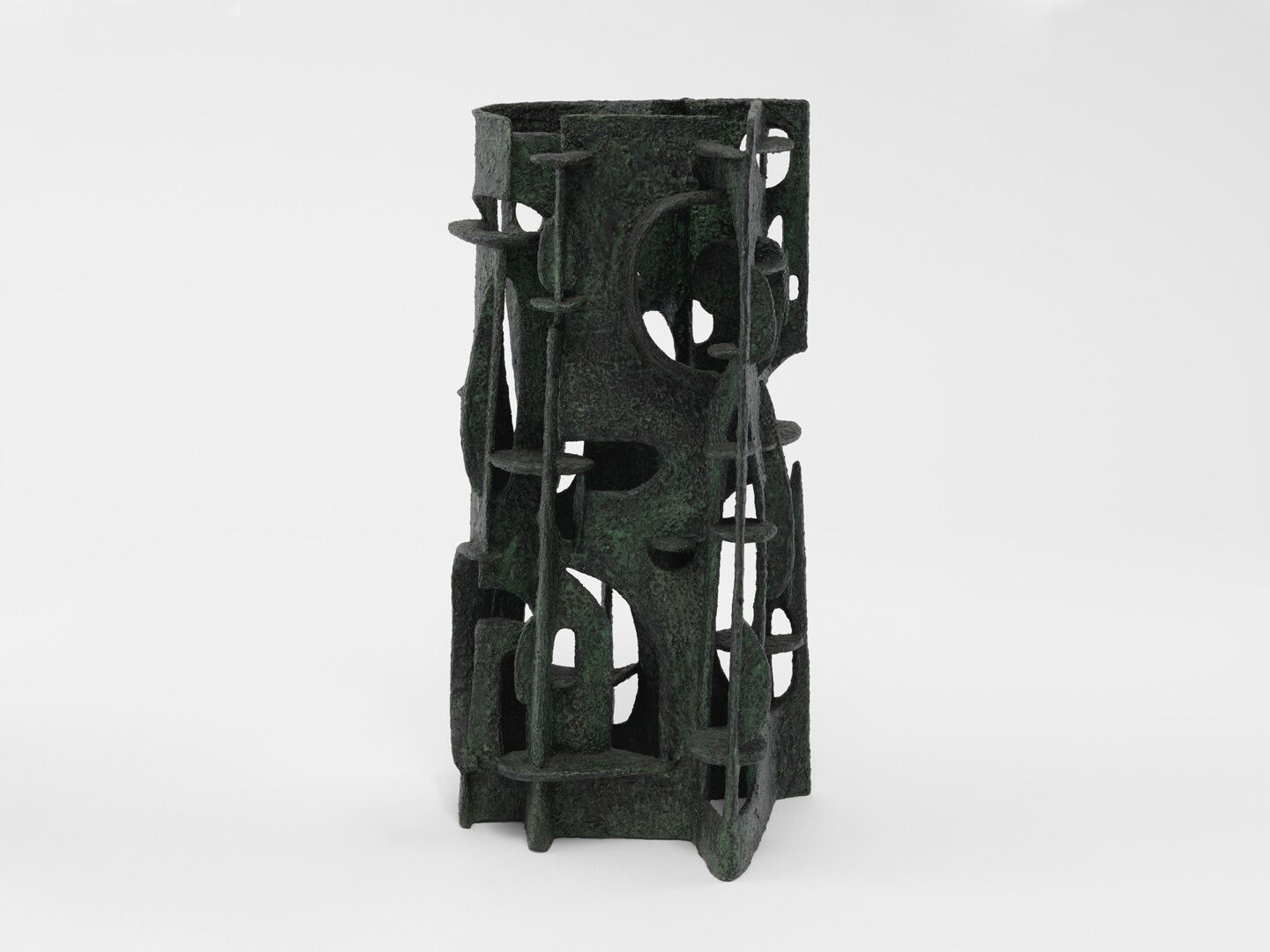 A polyvinyl acetate and sand sculpture by Leo Amino, titled, Green Manor, dated 1957.