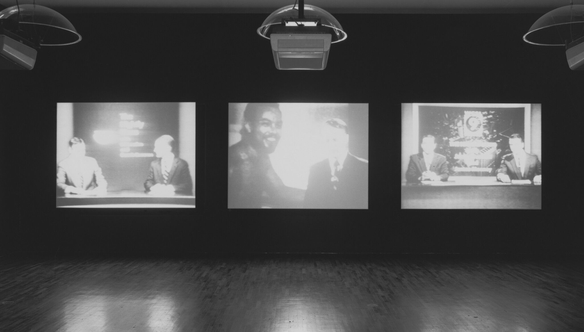 An installation view of Stan Douglas’s Evening, dated 1994, on view in Video Spaces: Eight Installations, The Museum of Modern Art, New York, 1995