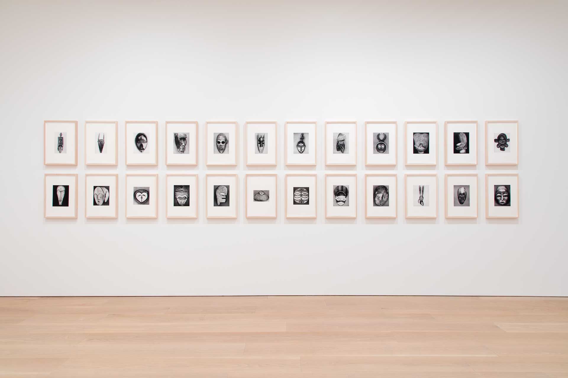 A work by Sherrie Levine titled African Masks After Walker Evans: 1–24, made of twenty-four glicée inkjet prints, dated 2014.