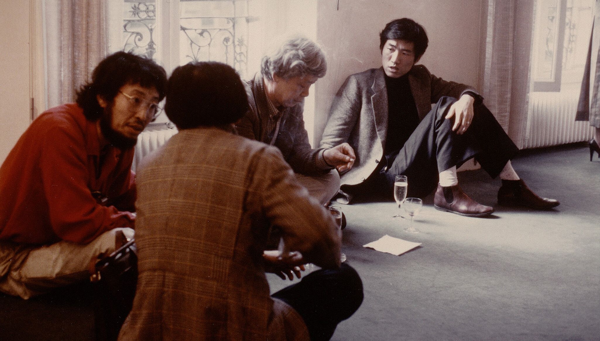 A Photo by Park Chung-um of Yun Hyong-keun (second from right) with fellow artists at the opening of Moon Mi Aie’s solo exhibition at Foundation Whanki, Paris, 1981. 
