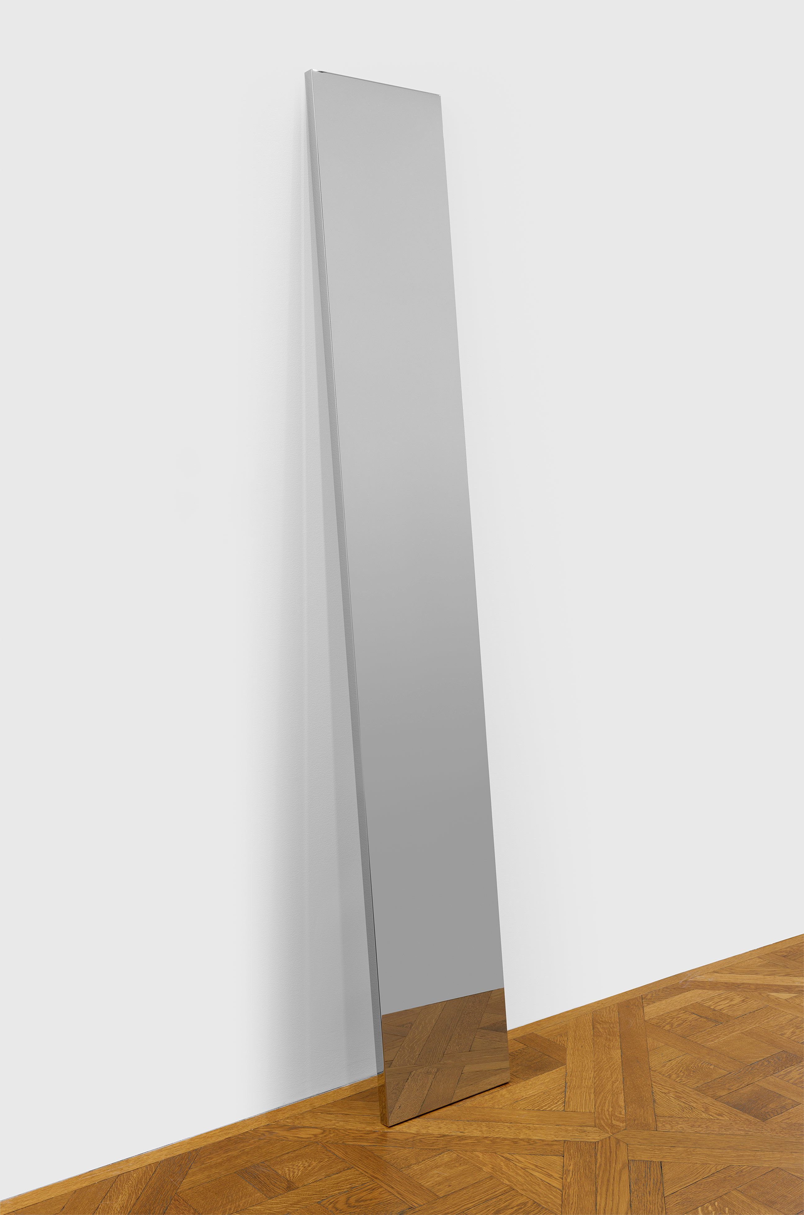 An untitled stainless steel sculpture by John McCracken, dated 2011.