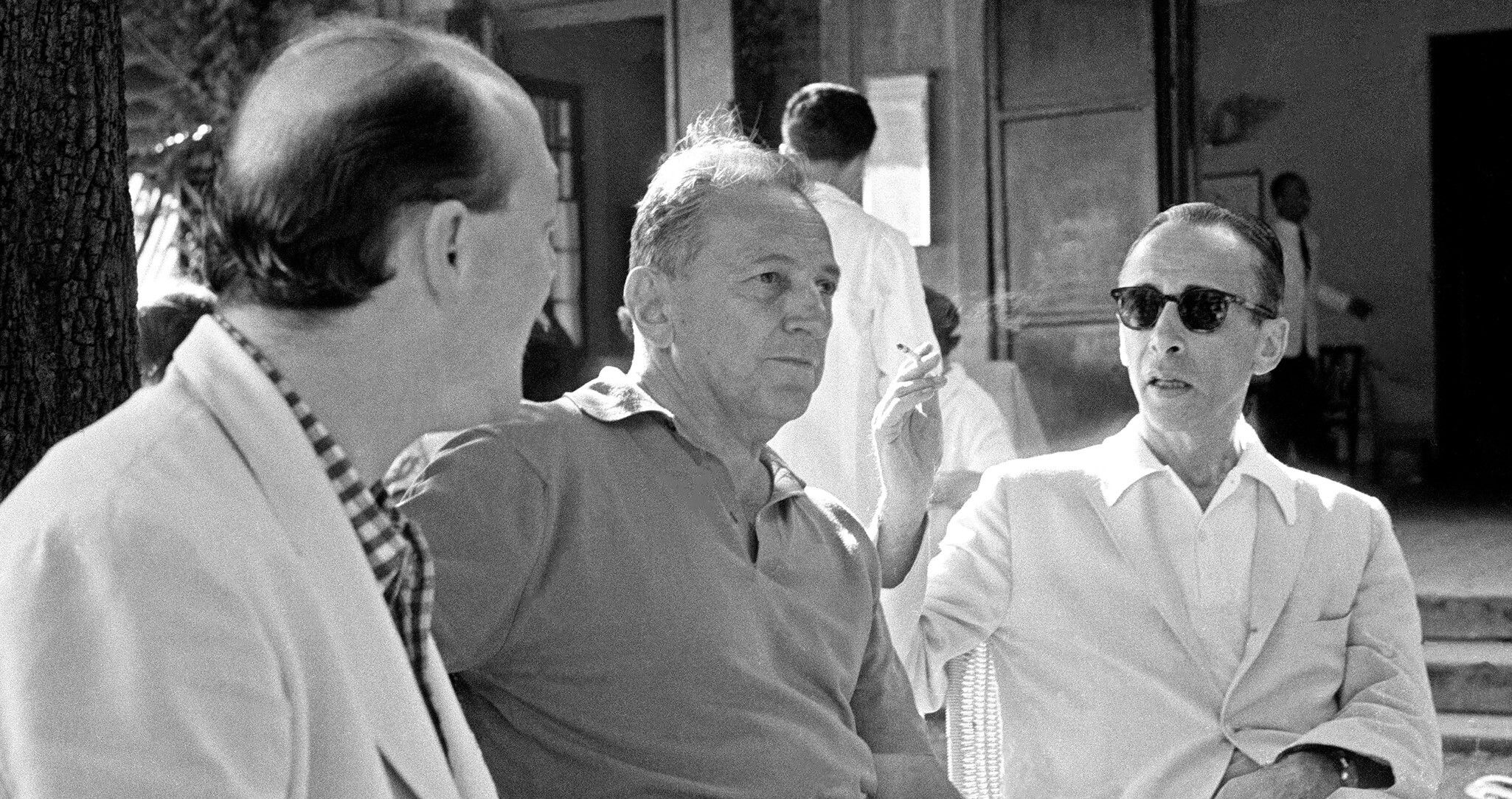 A photo of Piero Dorazio (left) with New York-based art dealers Sidney Janis (center) and Leo Castelli (right) at Caffè Paradiso in Venice during the 30th Venice Biennale, 1960.