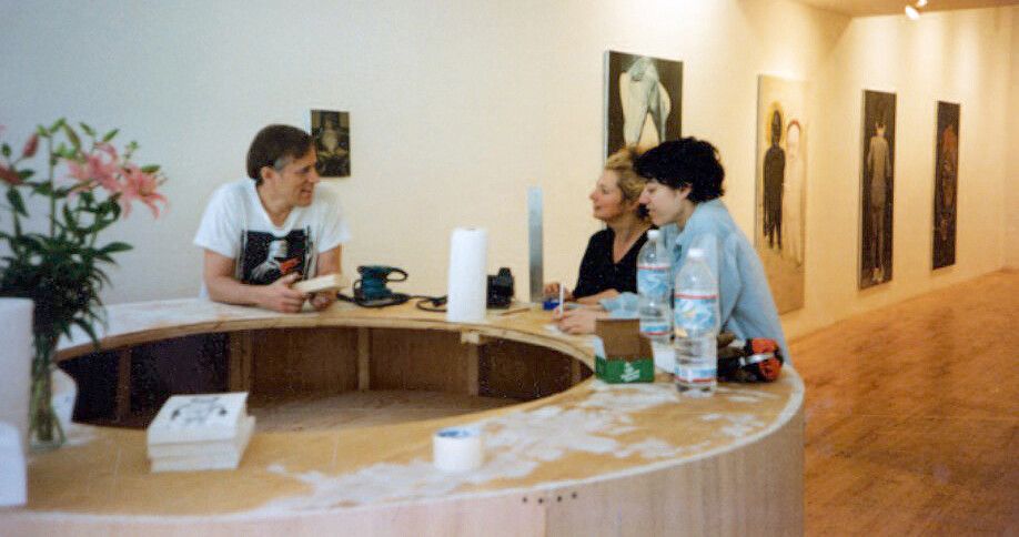 A photo with Jack Tilton, Marlene Dumas, and Nicole Eisenman during the installation of Not From Here at Jack Tilton Gallery in New York, dated 1994