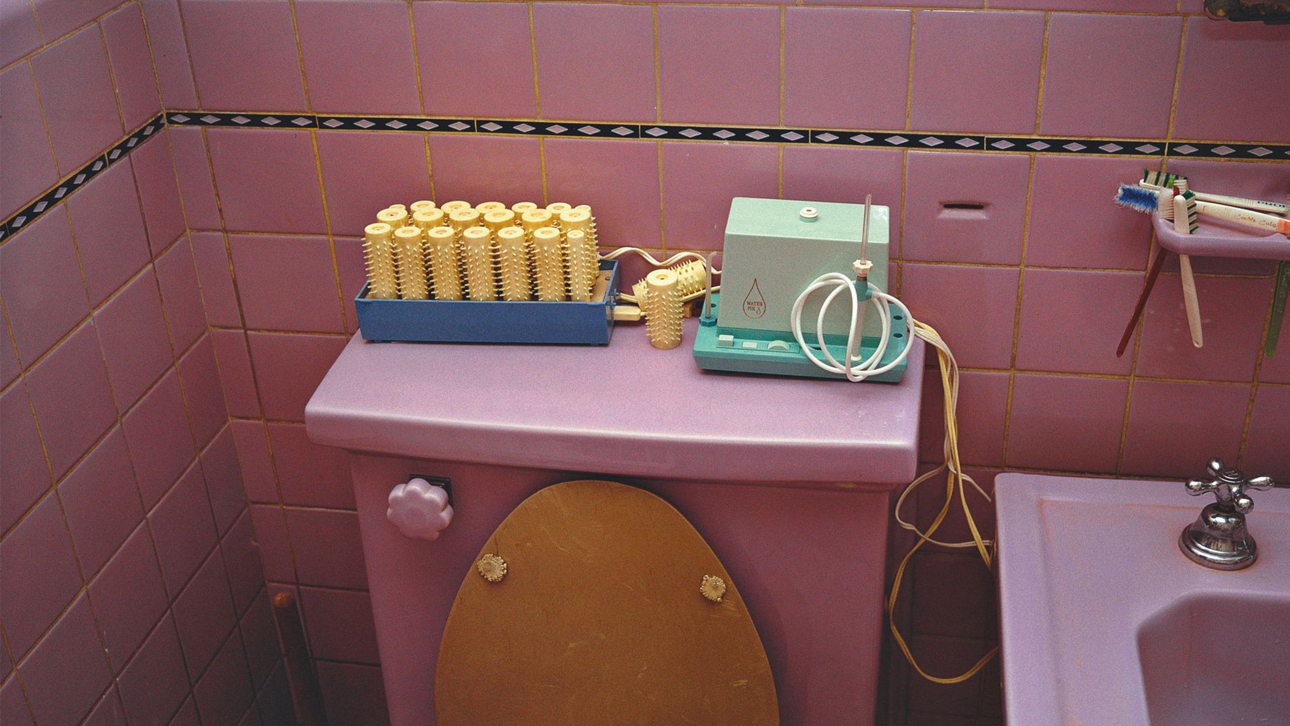 A detail photograph by William Eggleston, called UNTITLED [PINK BATHROOM], 1970–1973 