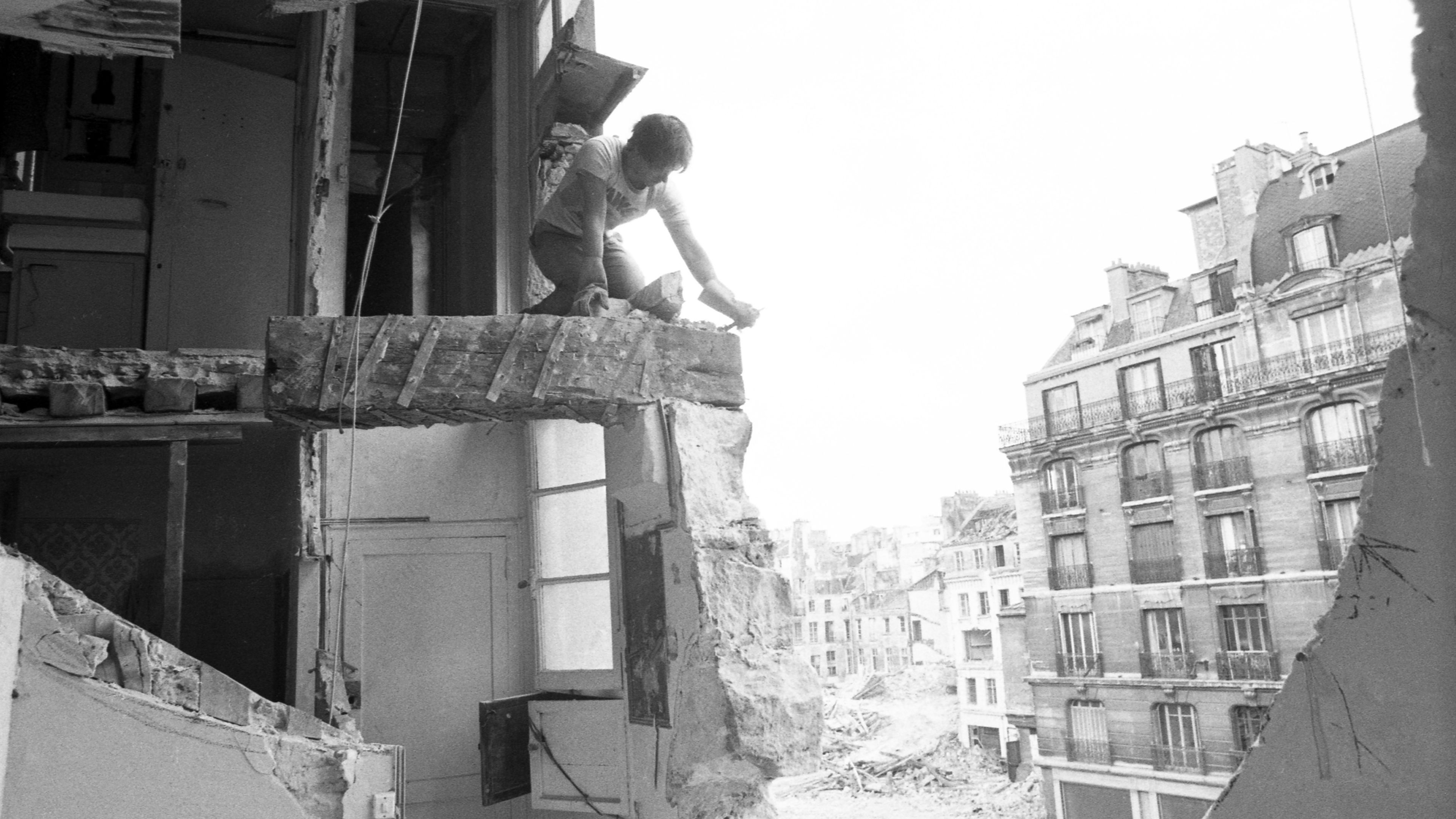Black-and-white image of Gordon Matta-Clark, titled Conical Intersect, dated 1975.