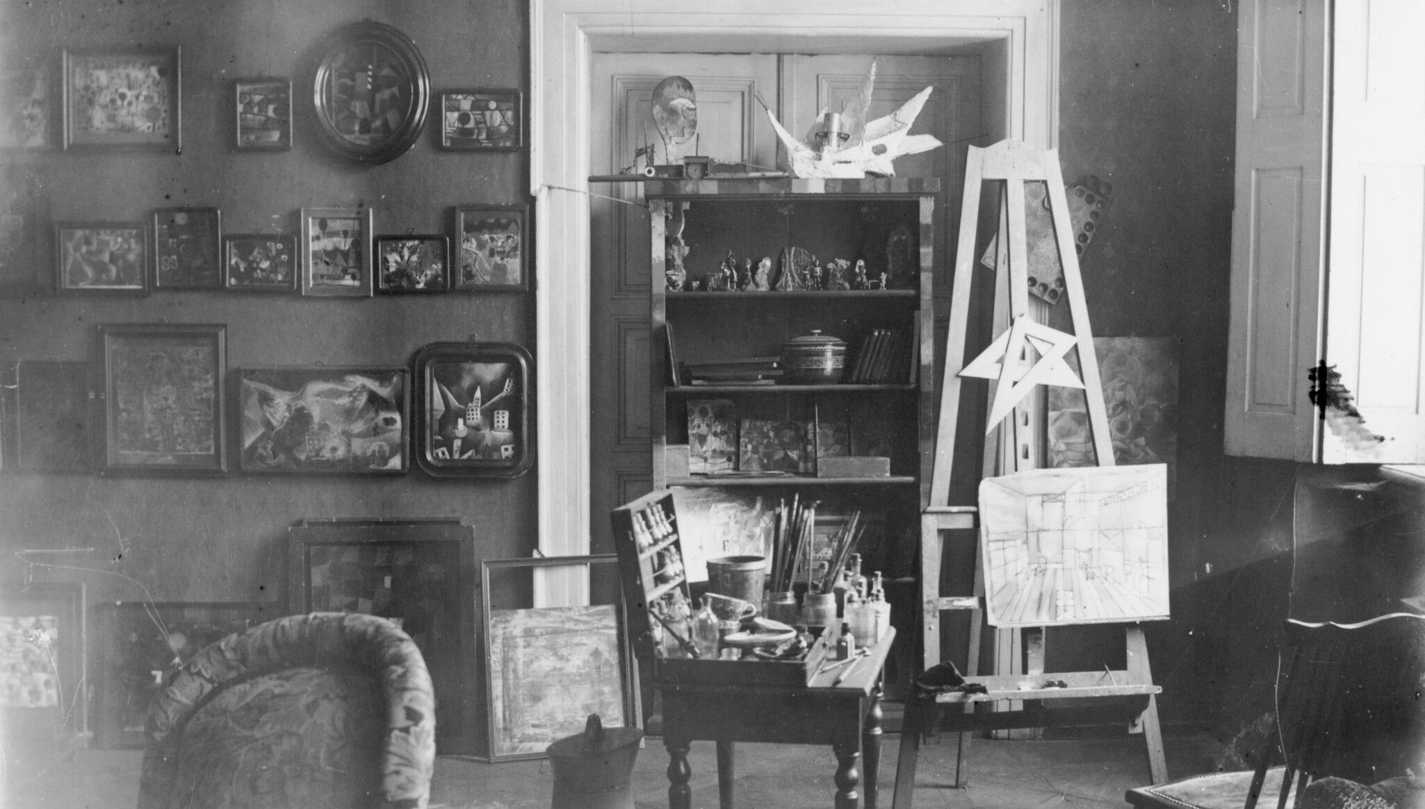 Klee’s Friedhof (Cemetery) (1920) pictured in his studio, second row, second from the left.