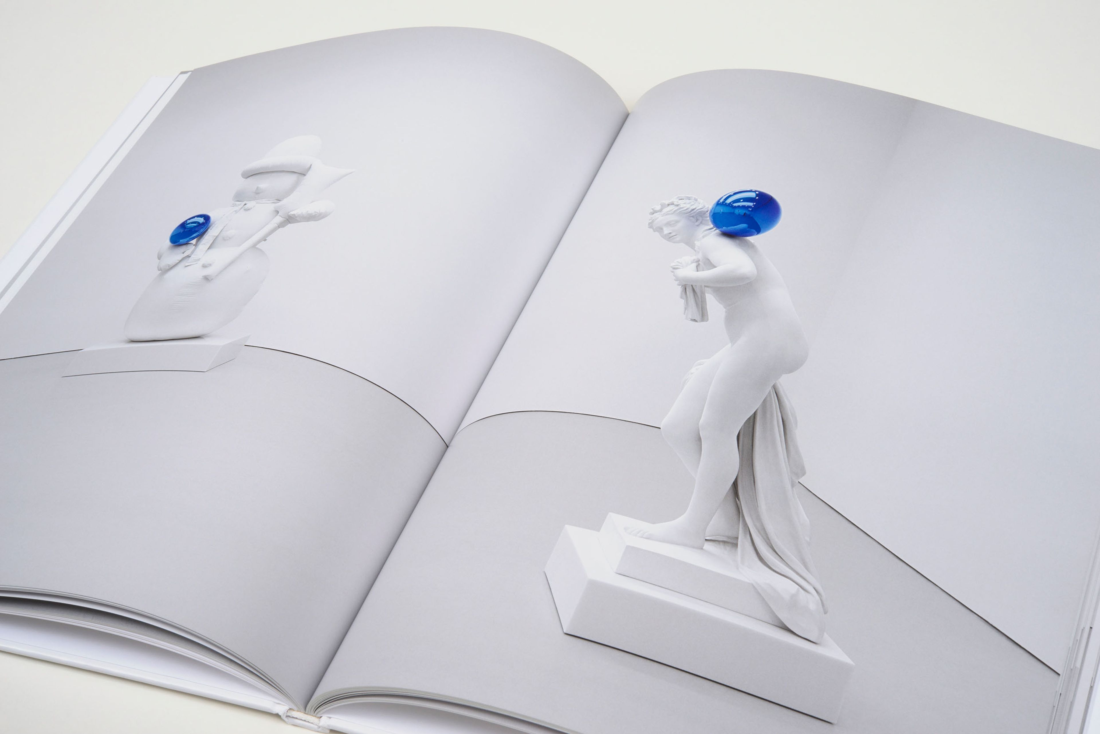 A photograph of a spread from the book Jeff Koons: Gazing Ball, dated 2014.