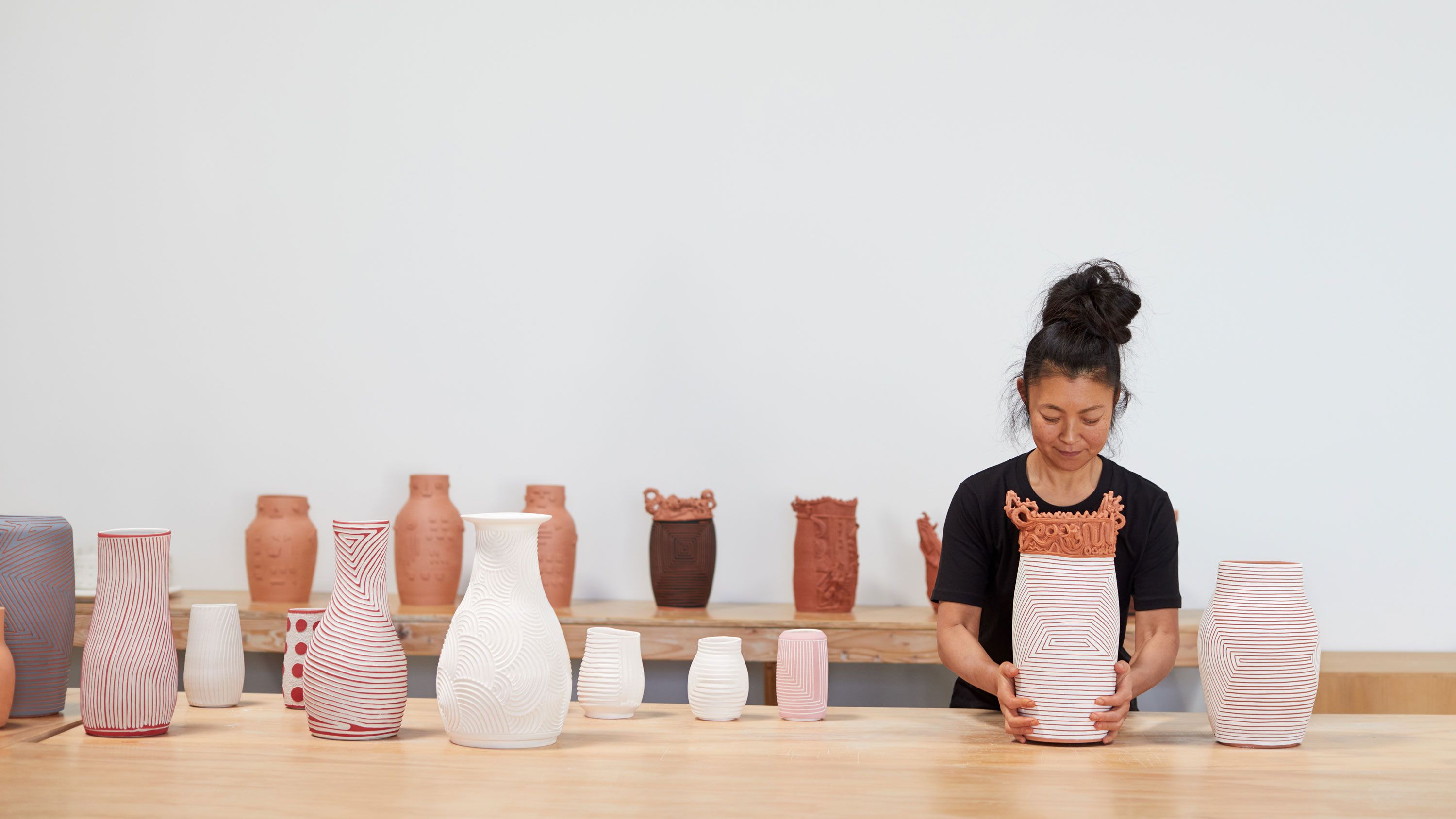 A portrait of Shio Kusaka in her studio, dated 2022