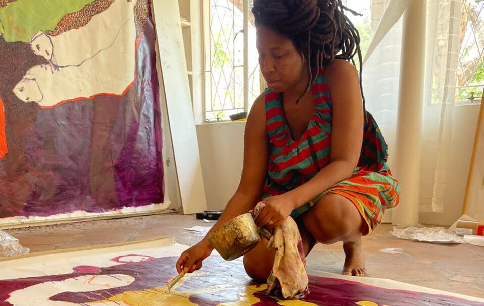 A photo of Portia Zvavahera in her studio, Harare, Zimbabwe, in 2021.