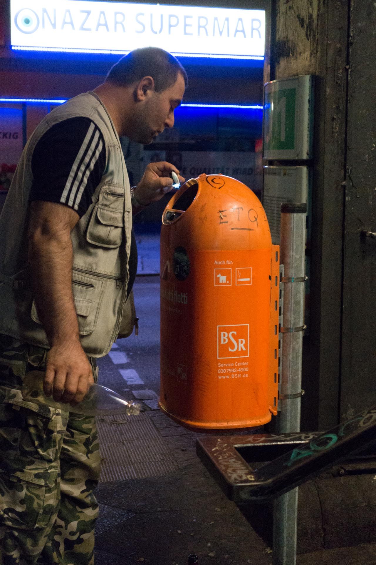 A photograph by Wolfgang Tillmans, titled Bottle collector, Berlin, dated 2015.