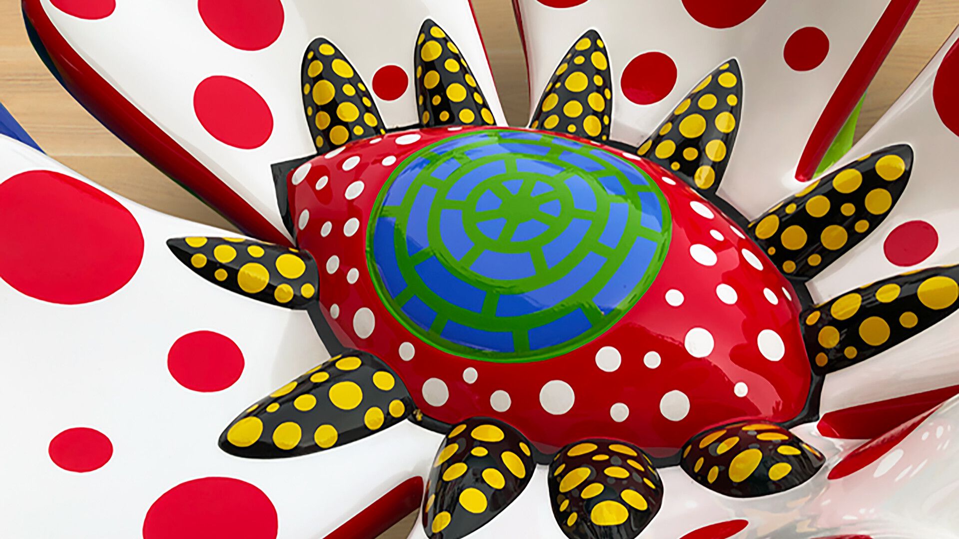 A detail of a fiberglass reinforced plastic, metal, and urethane paint sculpture by Yayoi Kusama, titled Flowers that Bloom at Night S2B, dated 2009.