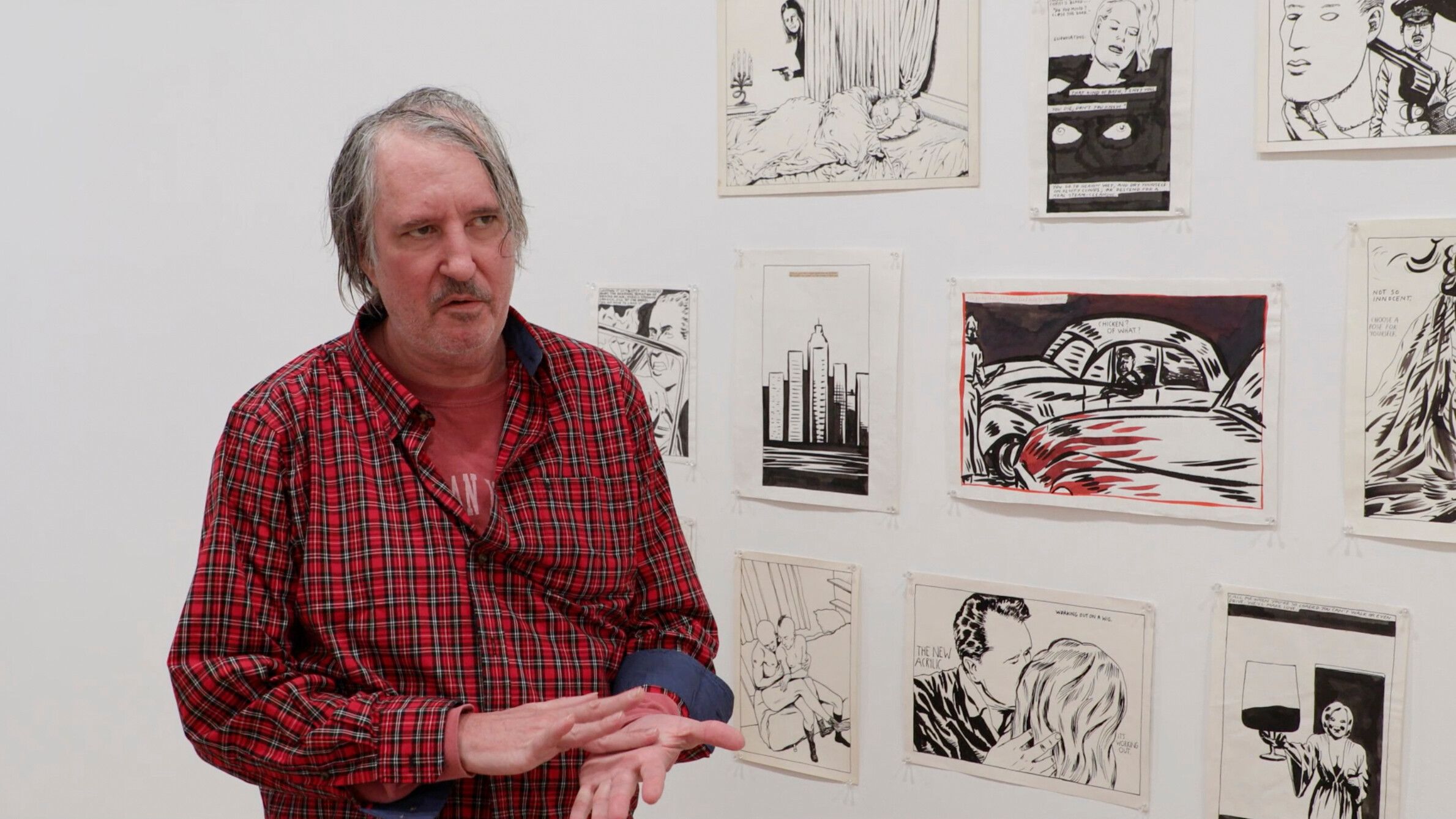 Raymond Pettibon with his drawings