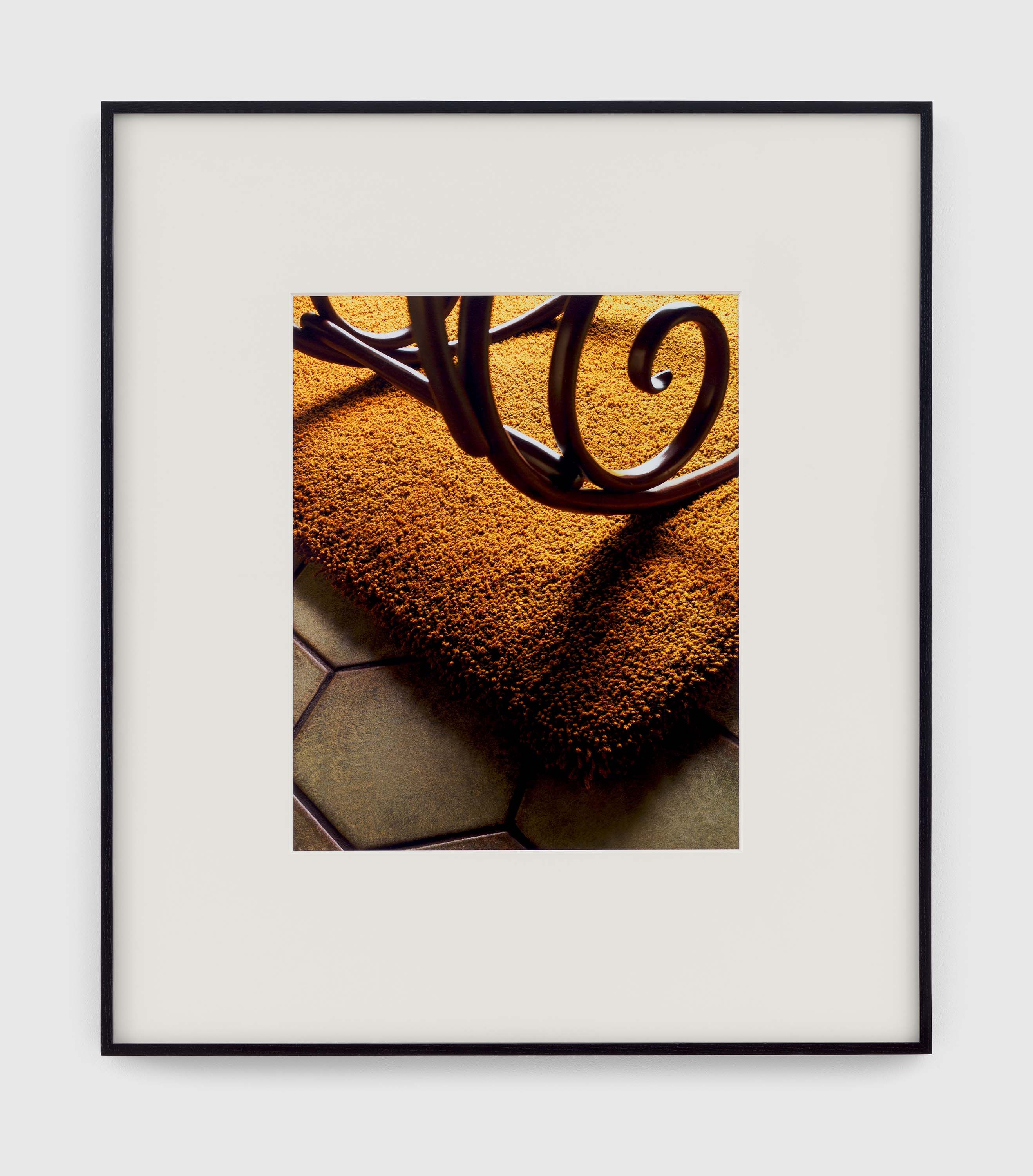 A photograph by Christopher Williams, titled Untitled (Beauty, happiness at ground level. A carpet of pure new wool embellishes everything that it touches. If you have never seen your furniture on a beautiful carpet, then you have never seen it. If you have never walked barefoot, in your house, on the softness of wool, then you are ignoring a great pleasure. Because a good carpet, of true, vibrant, natural wool, makes life more beautiful. Strict laboratory tests have verified all the qualities of the velvet, 100% pure new wool carpets that merit the Woolmark label: purity, strength, comfort, sound- and thermal-insulation, resistance of colors, non-inflammability, easy maintenance, permanent moth-proof treatment. Choosing a carpet is a serious matter. A matter of happiness. So, always check the Woolmark label. You will be certain to have a carpet of 100% pure new wool. You will be certain that you are making the best business. In pure new wool, it‘s a real carpet. Ask for Woolmark.) Studio Rhein Verlag, Düsseldorf February 29, 2016, dated 2016.