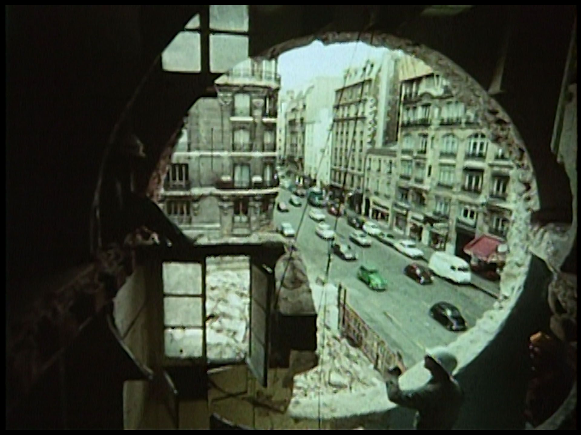 A film by Gordon Matta-Clarke, titled Conical Intersect, dated 1975.