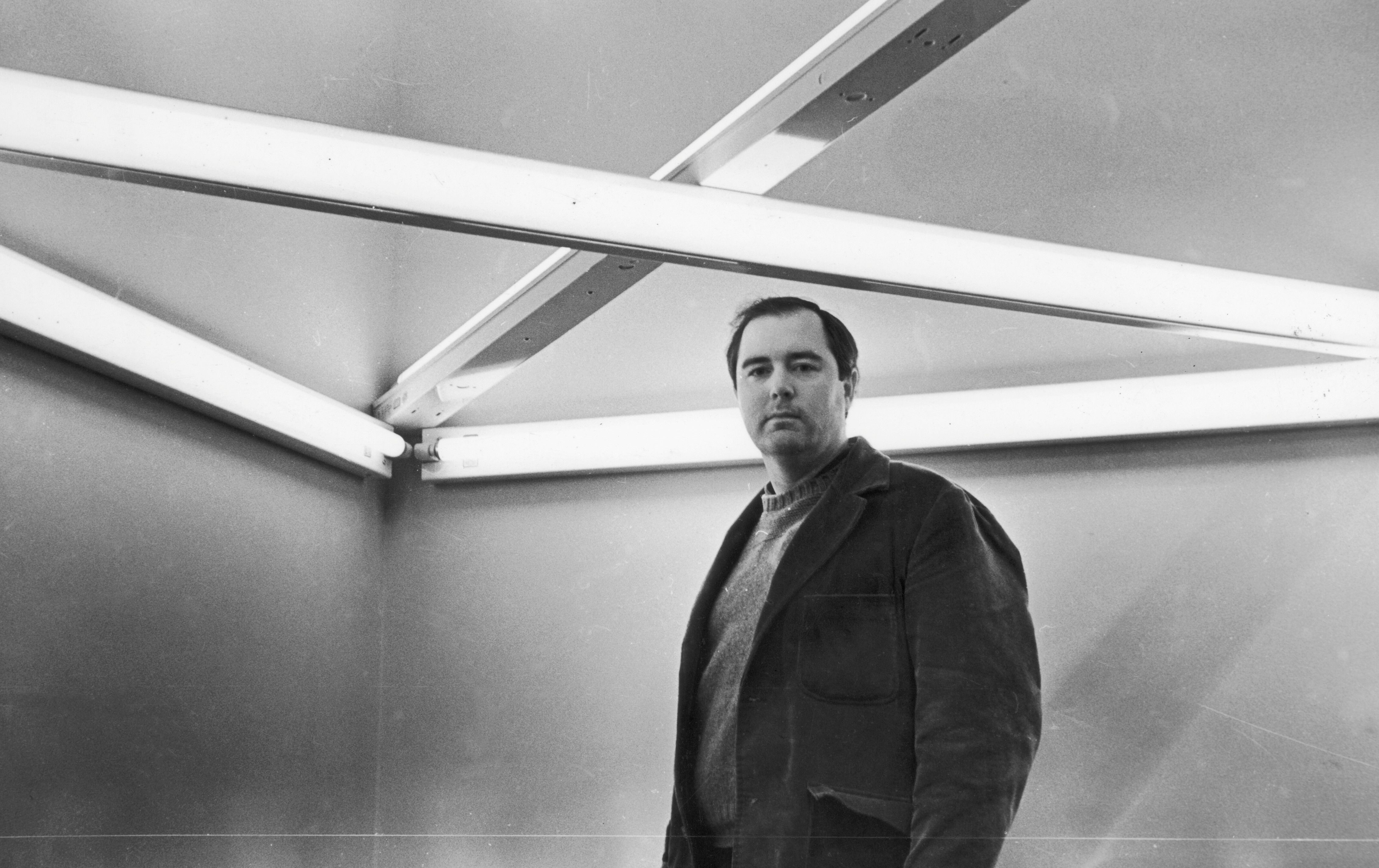 A photo of Dan Flavin, dated 1966.