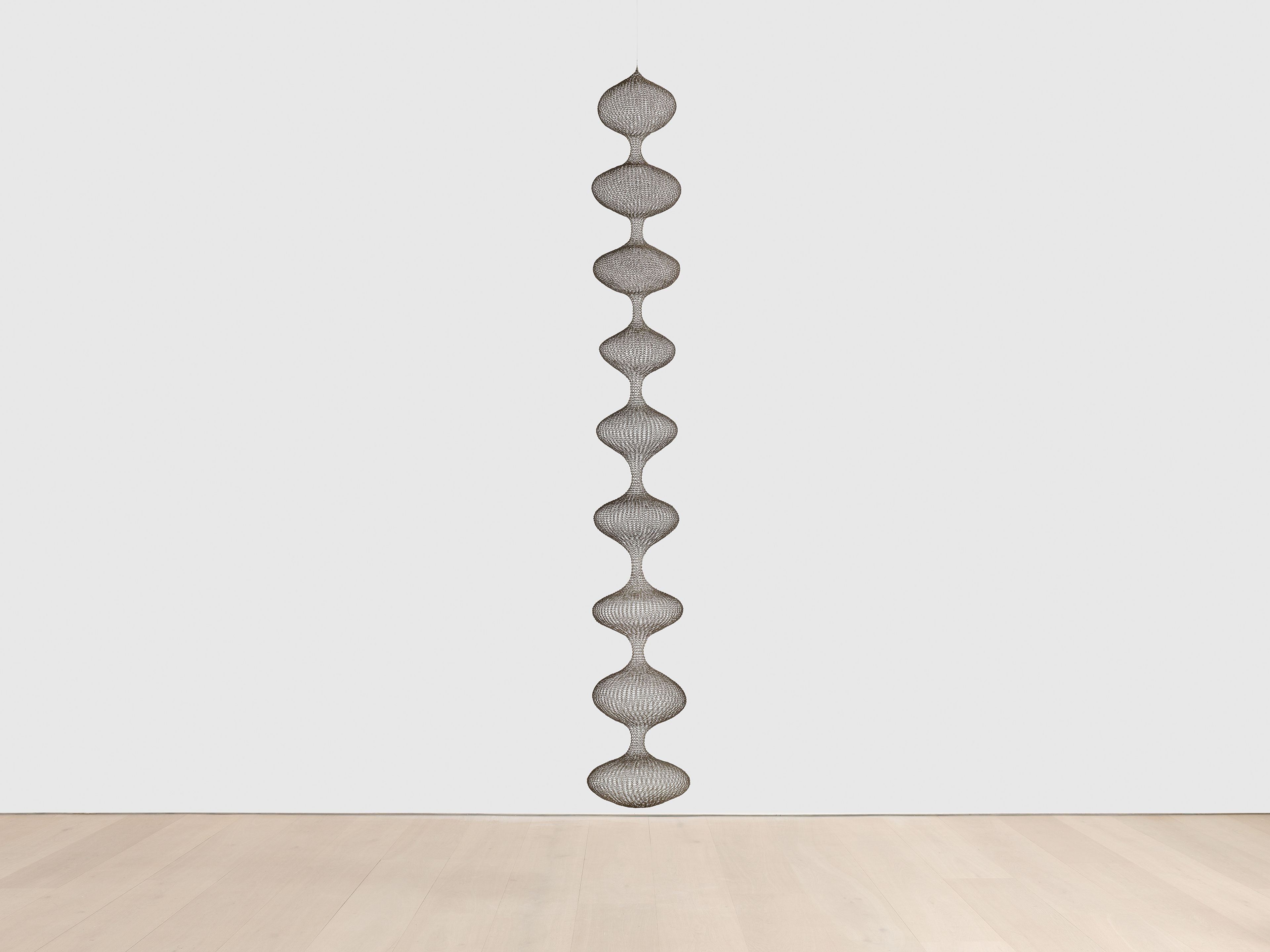 A sculpture by Ruth Asawa, called Untitled (S.278, Hanging Nine-Lobed, Single-Layered Continuous Form), dated circa 1955.