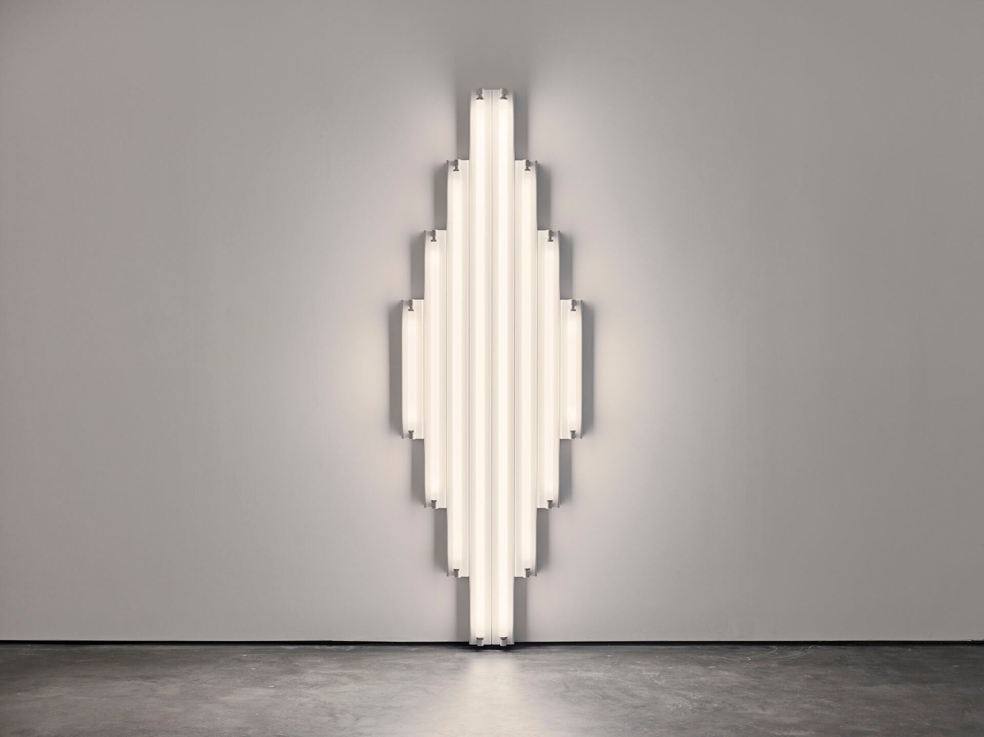A sculpture by Dan Flavin, composed of cool white fluorescent light, titled "monument" for V. Tatlin, dated 1968.
