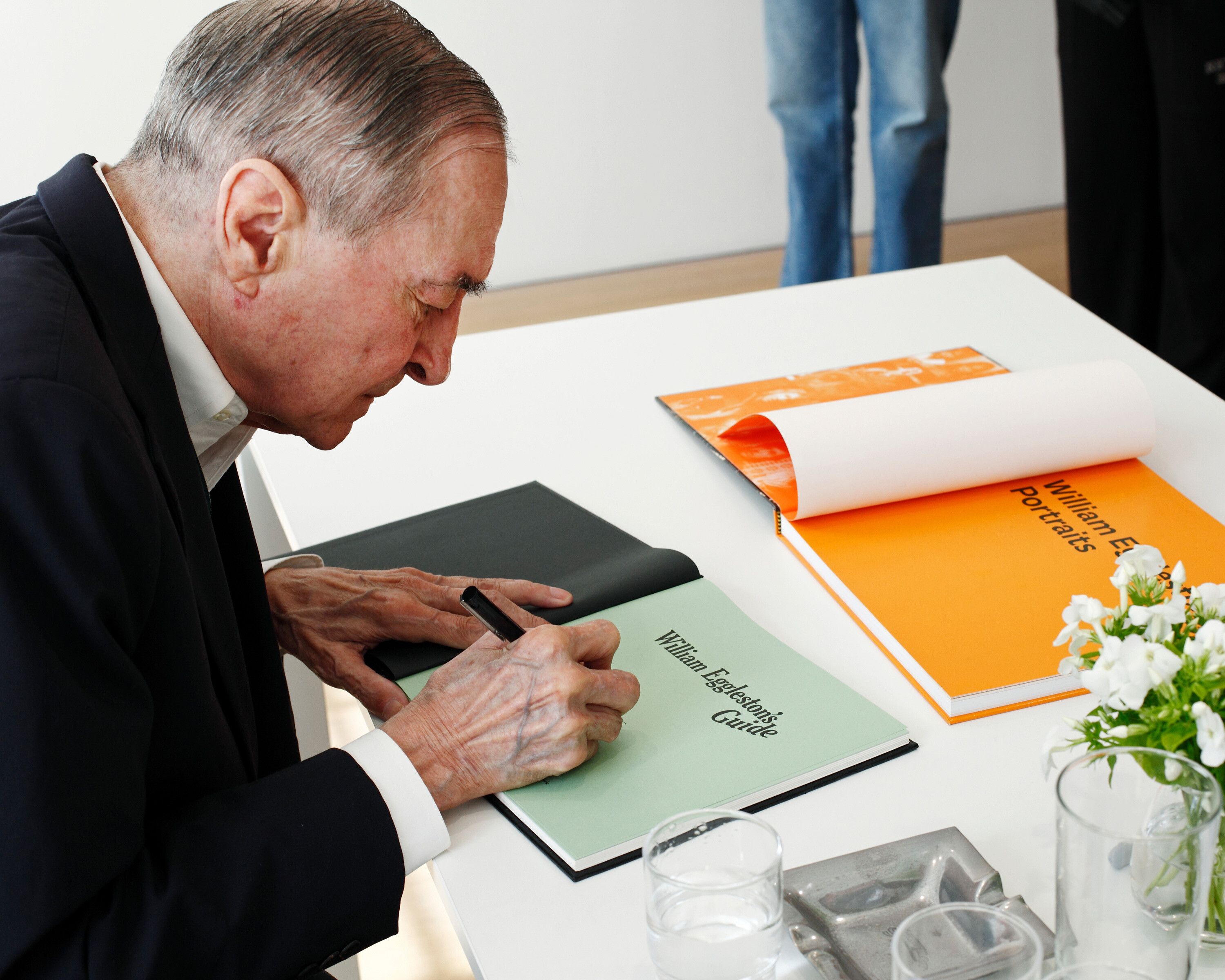 William Eggleston signing his book at David Zwirner London gallery