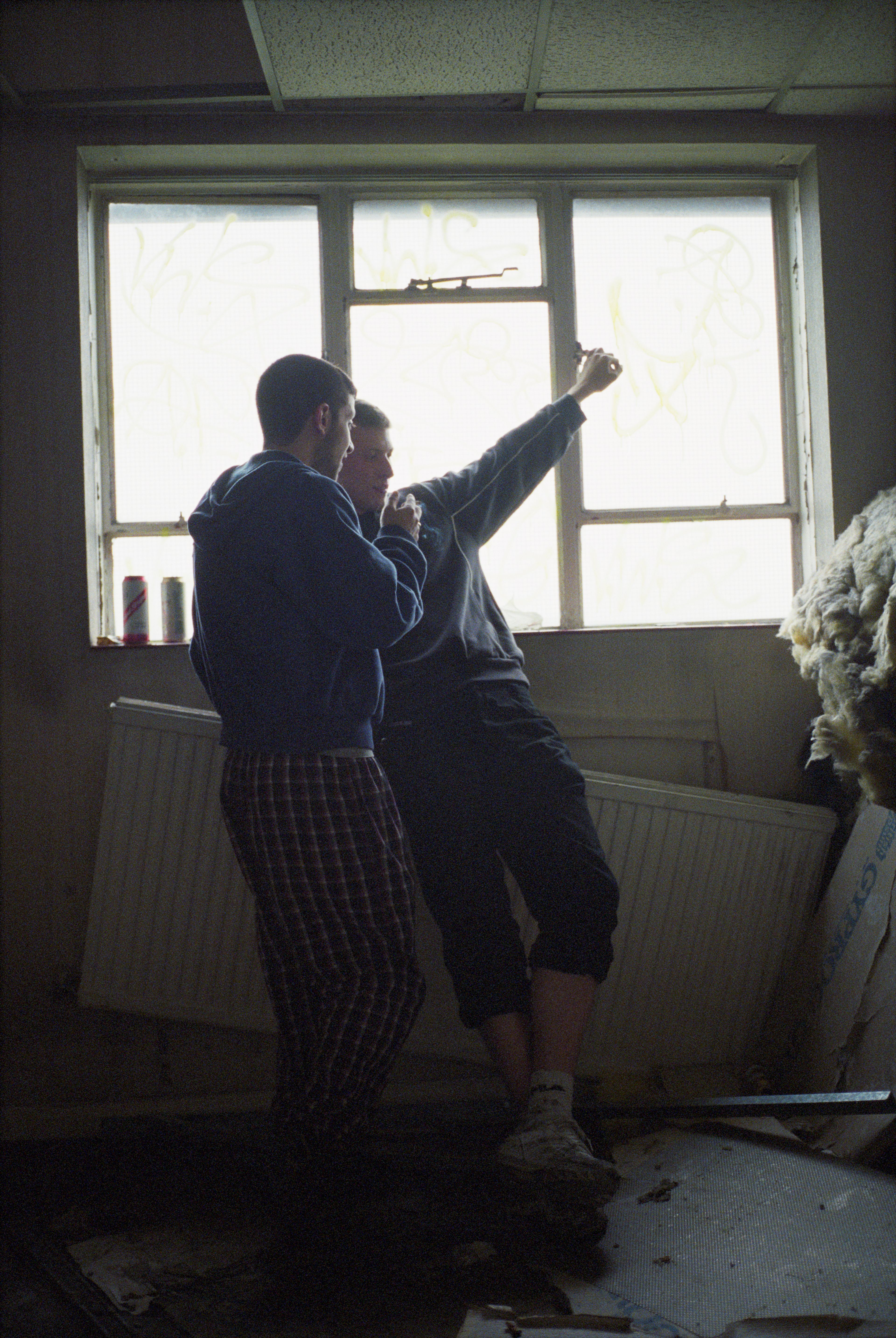 A photograph by Wolfgang Tillmans, titled Nasir & Karl, Behind Bars, dated 2008.