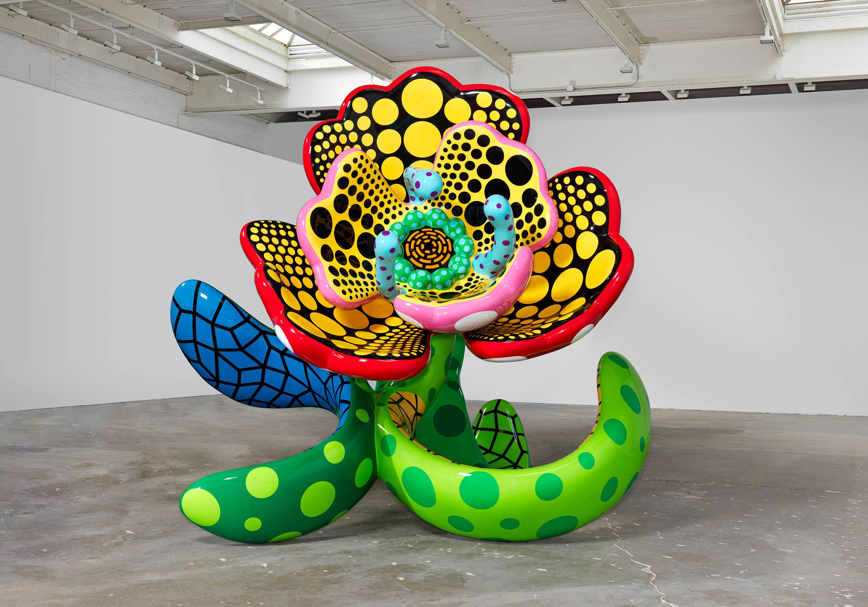 A sculpture by Yayoi Kusama, titled I Spend Each Day Embracing Flowers, dated 2023.