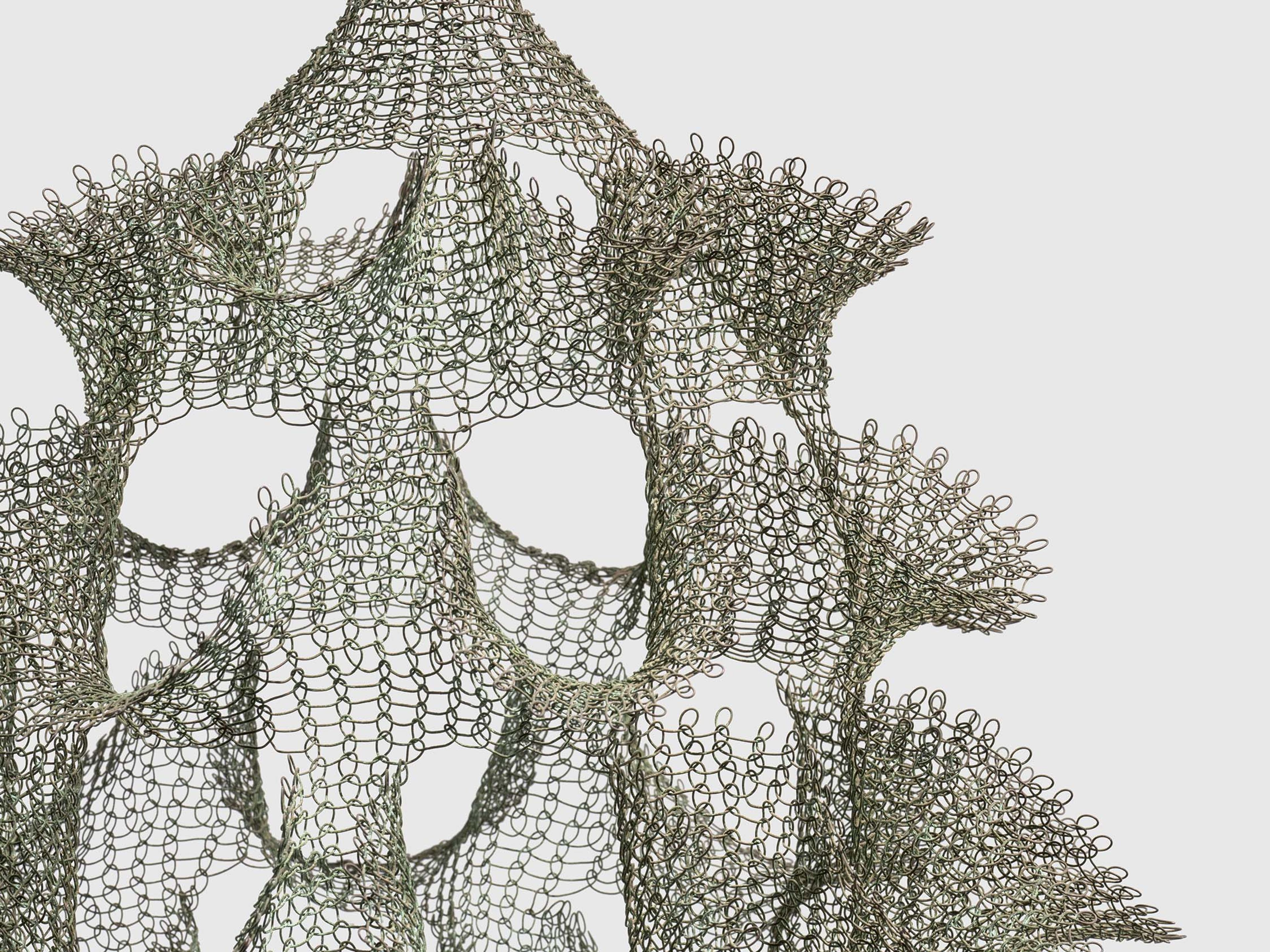 A detail of a sculpture by Ruth Asawa, titled Untitled (S.483, Hanging Single-Section, Reversible Open-Window Form), dated circa 1950.