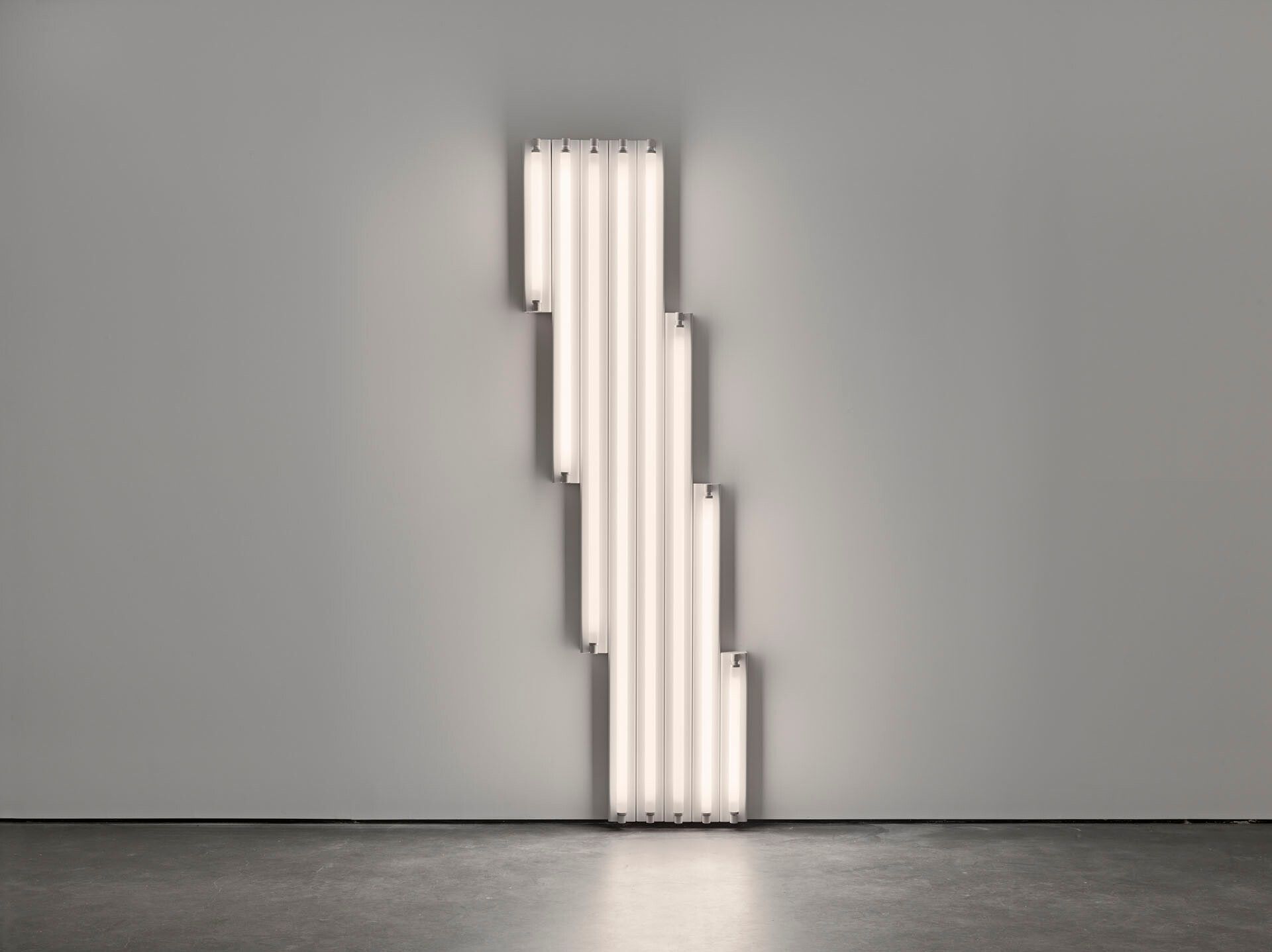 A sculpture by Dan Flavin, composed of cool white fluorescent light, titled "monument" for V. Tatlin, dated 1968.